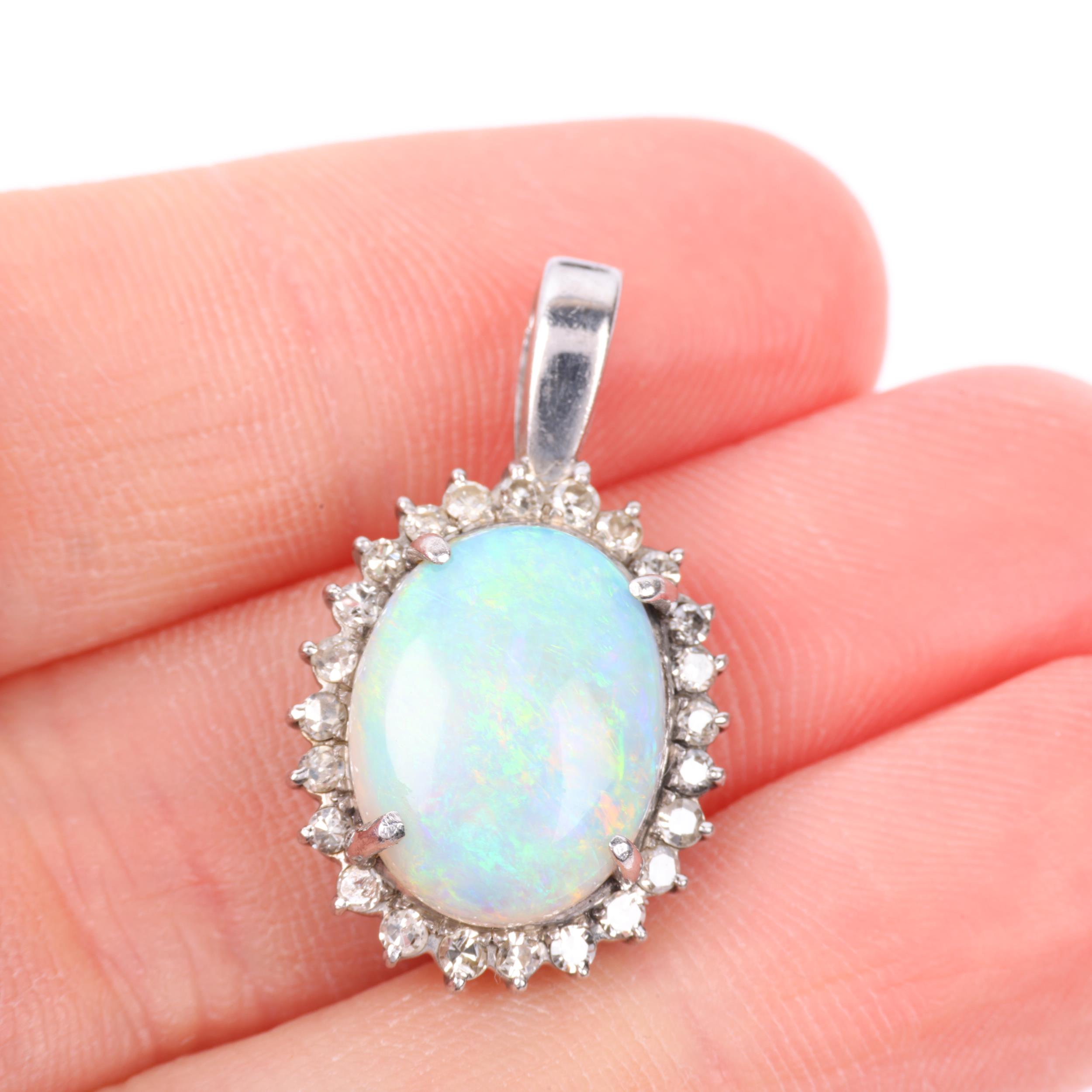 A late 20th century opal and diamond oval cluster pendant, claw set with 3ct oval cabochon opal - Image 4 of 4