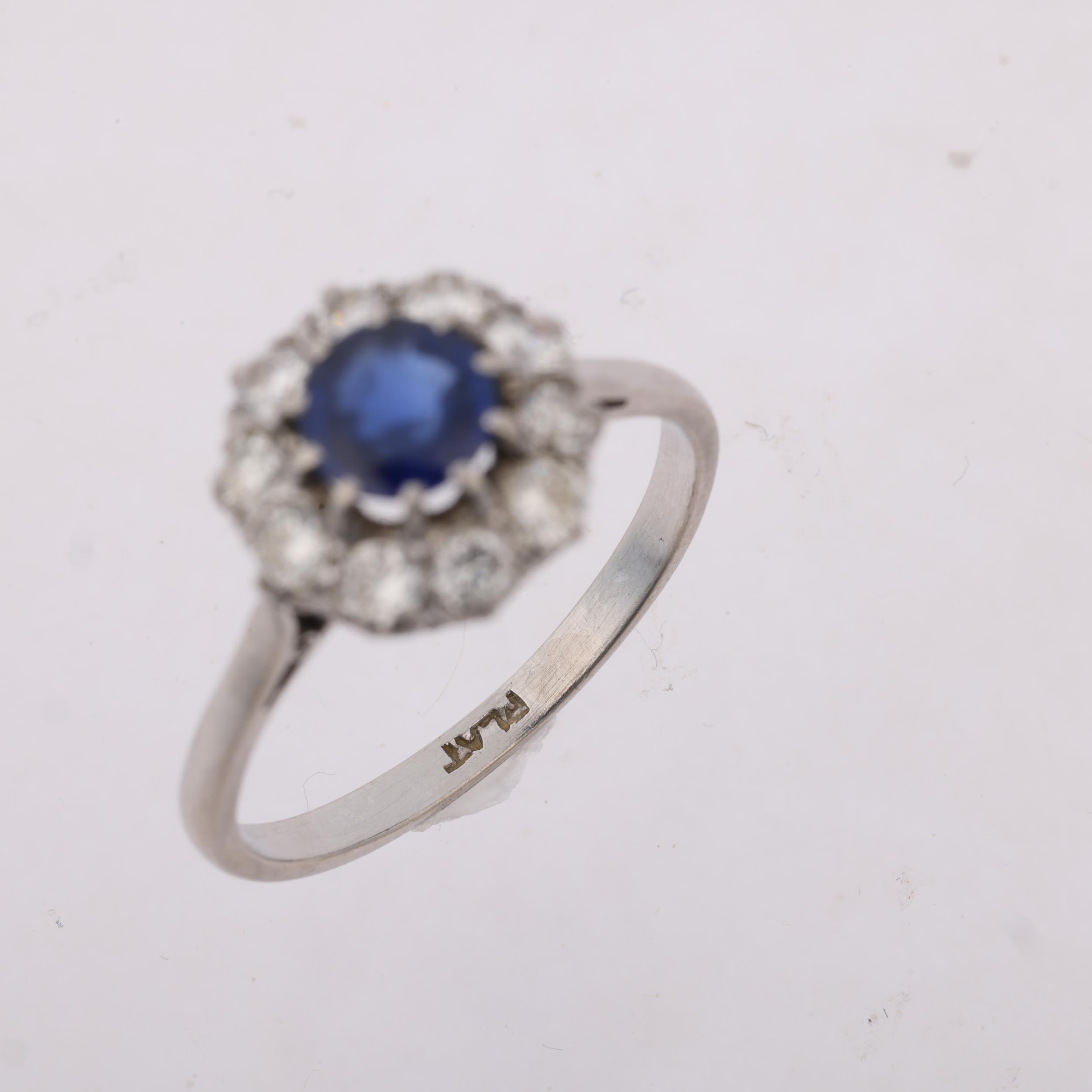 A mid-20th century platinum sapphire and diamond flowerhead cluster ring, claw set with round-cut - Image 3 of 4