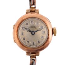 A lady's 9ct rose gold mechanical bracelet watch, by Douglas of Stourbridge, silvered dial with