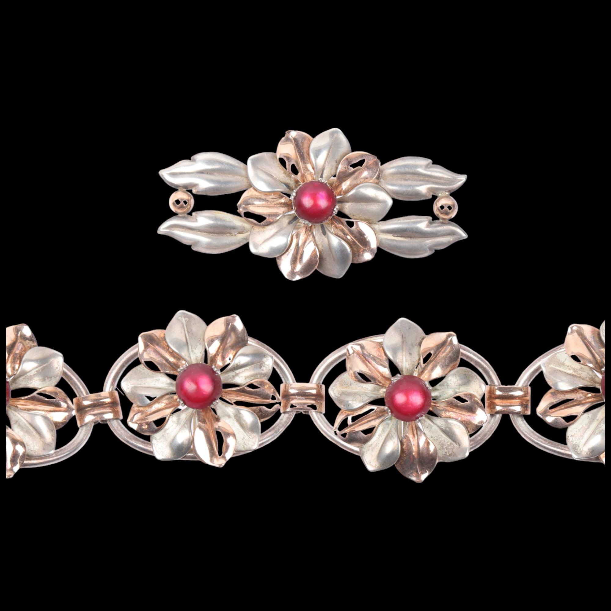 KREISLER - an American sterling silver-gilt stone set flowerhead panel bracelet and brooch set,