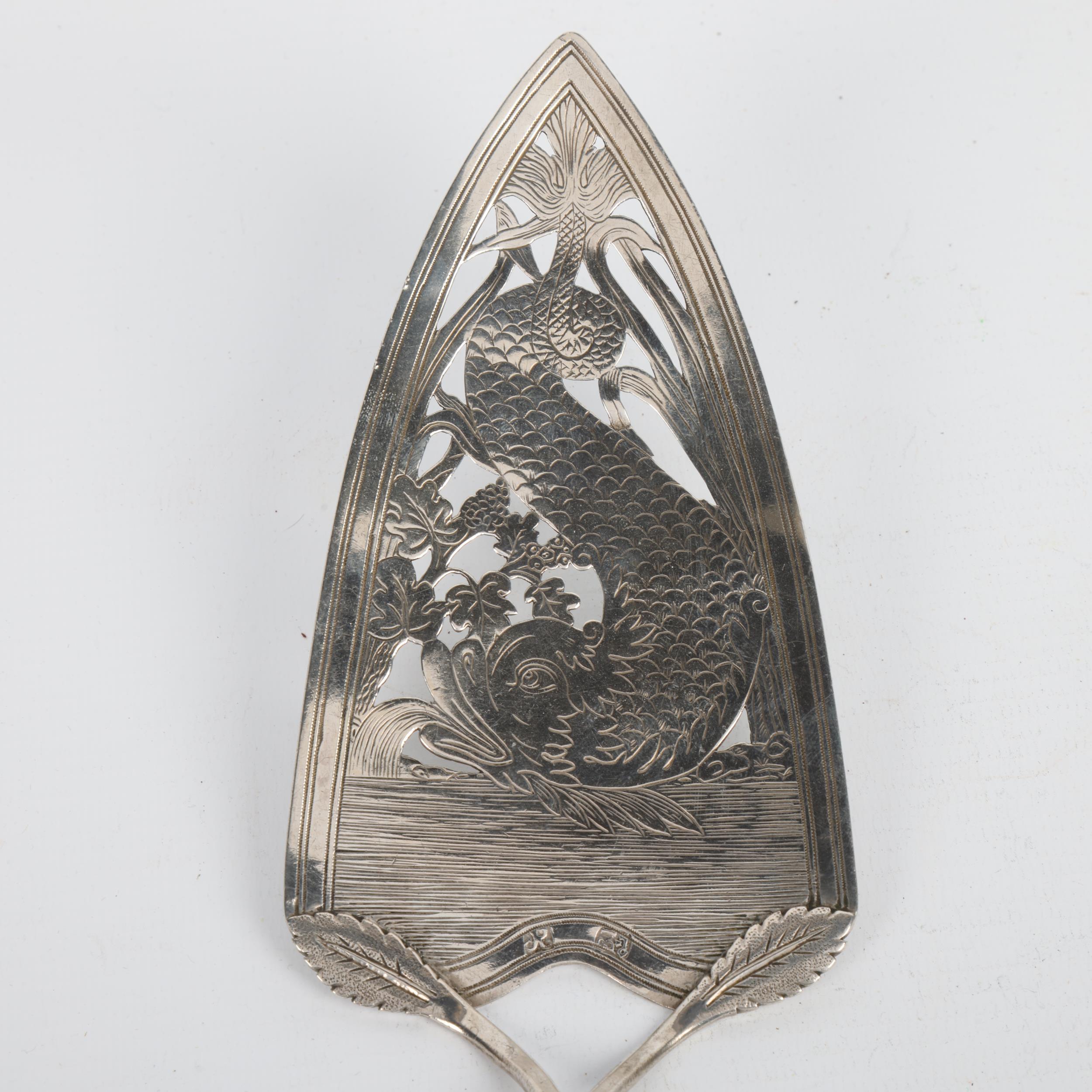 An 18th century Continental silver fish serving slice, indistinct marks, pierced and bright-cut - Image 2 of 3