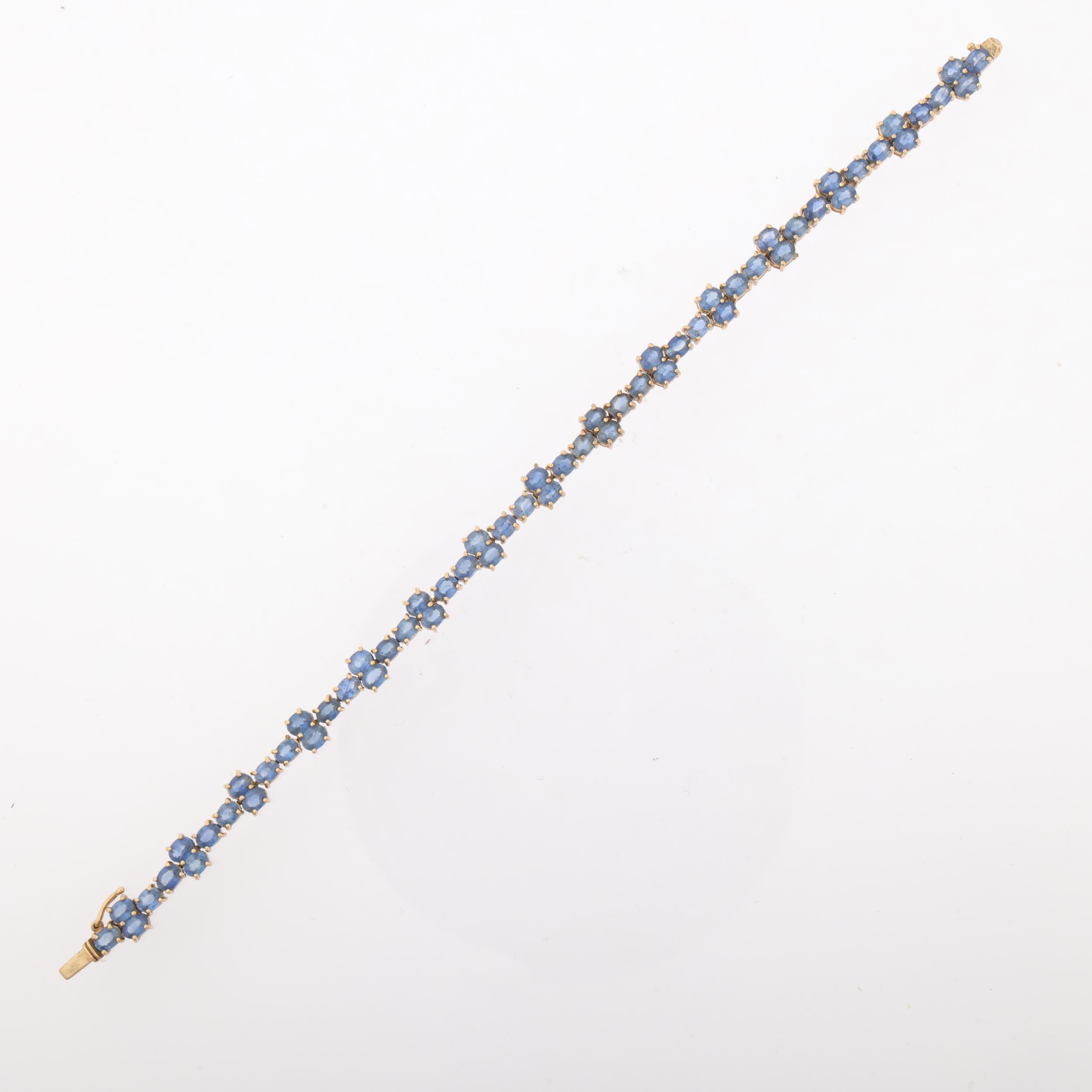 A modern 9ct gold sapphire tennis line bracelet, Birmingham 2005, set with oval mixed-cut sapphires, - Image 2 of 4