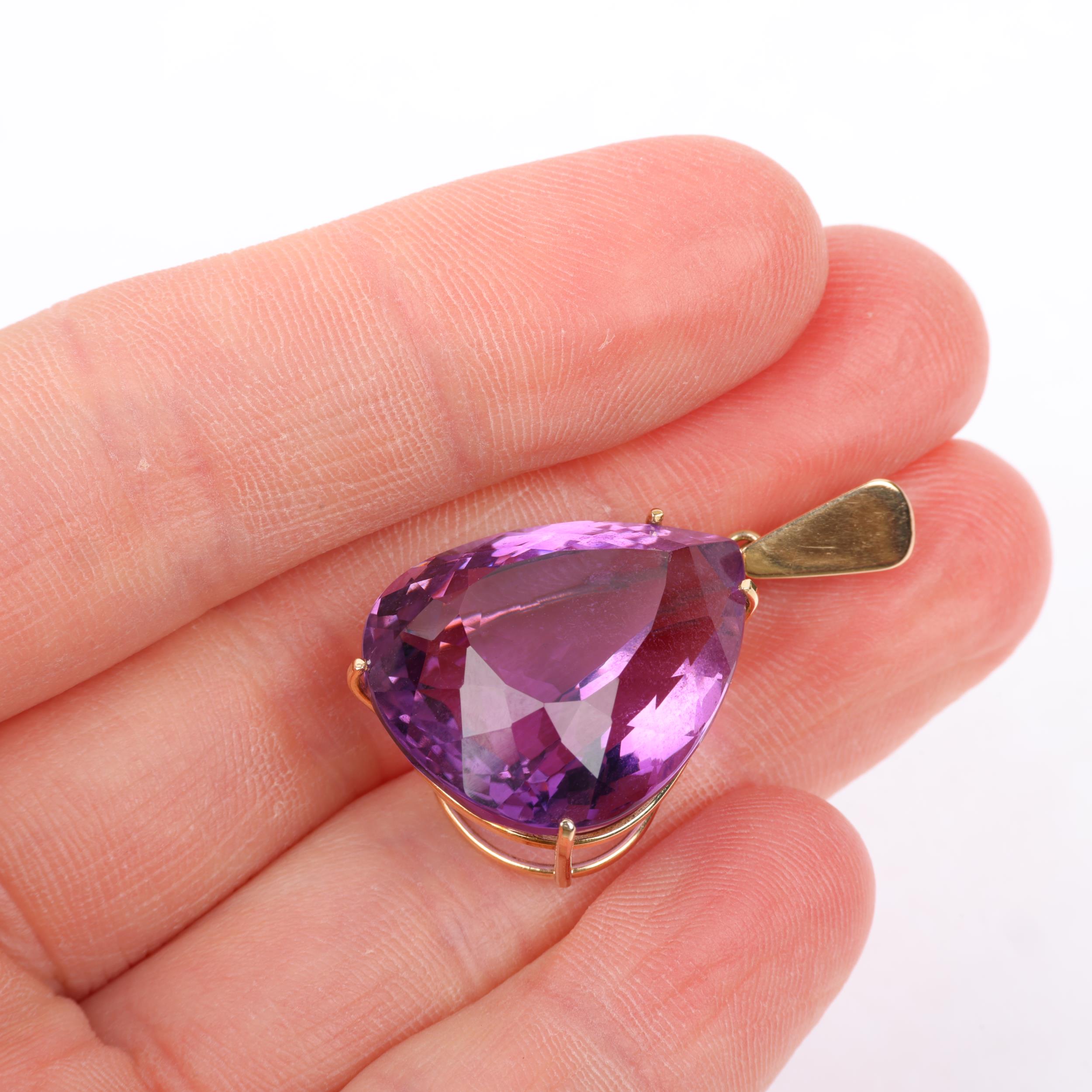 A 14ct gold amethyst drop pendant, set with 28ct pear-cut amethyst, 33.4mm, 6.8g Condition Report: - Image 4 of 4