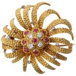 A large 1960s ruby and diamond flowerhead brooch, textured settings with round-cut rubies and