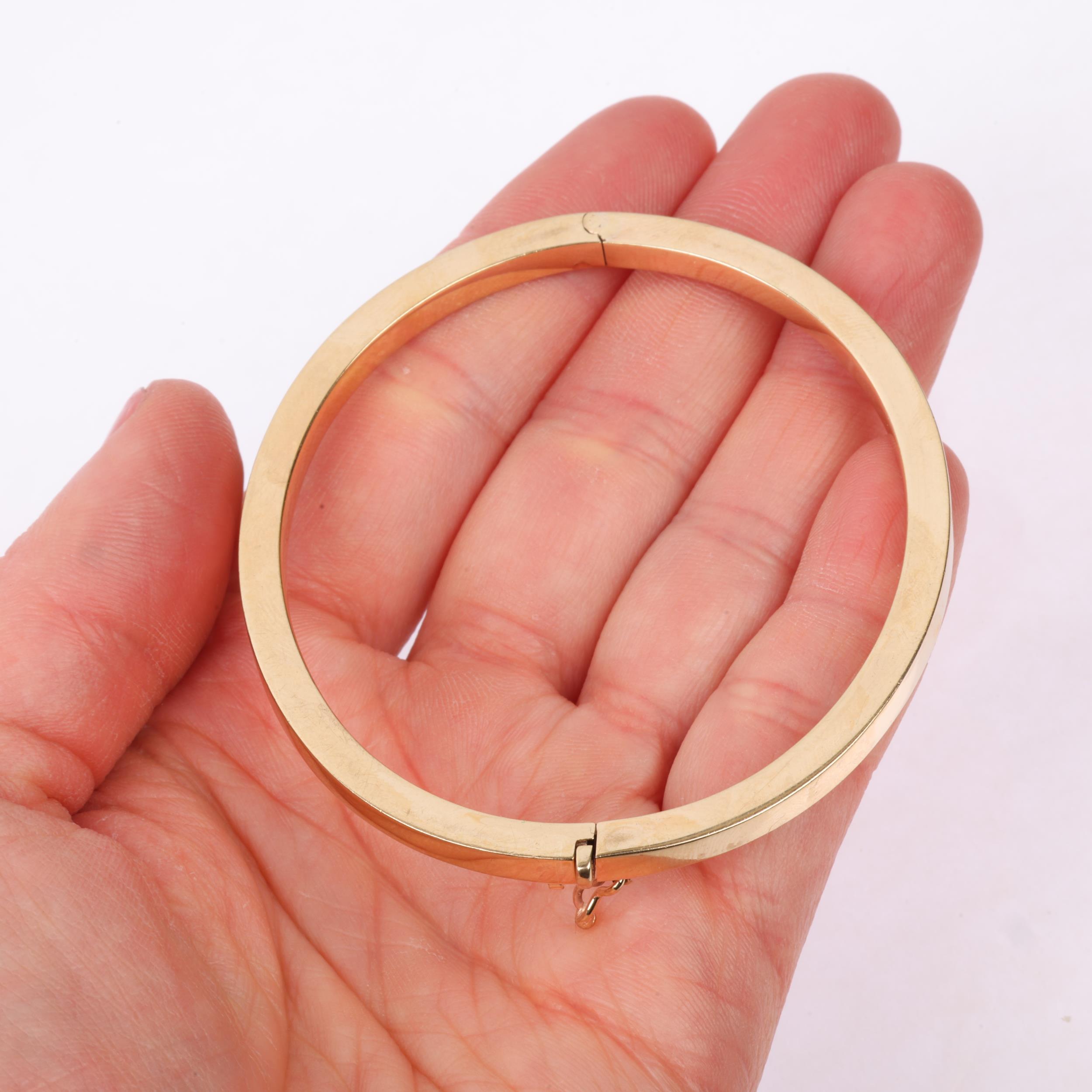 A 9ct gold plain hinged bangle, band width 4.1mm, internal circumference 18cm, 10.7g Condition - Image 4 of 4