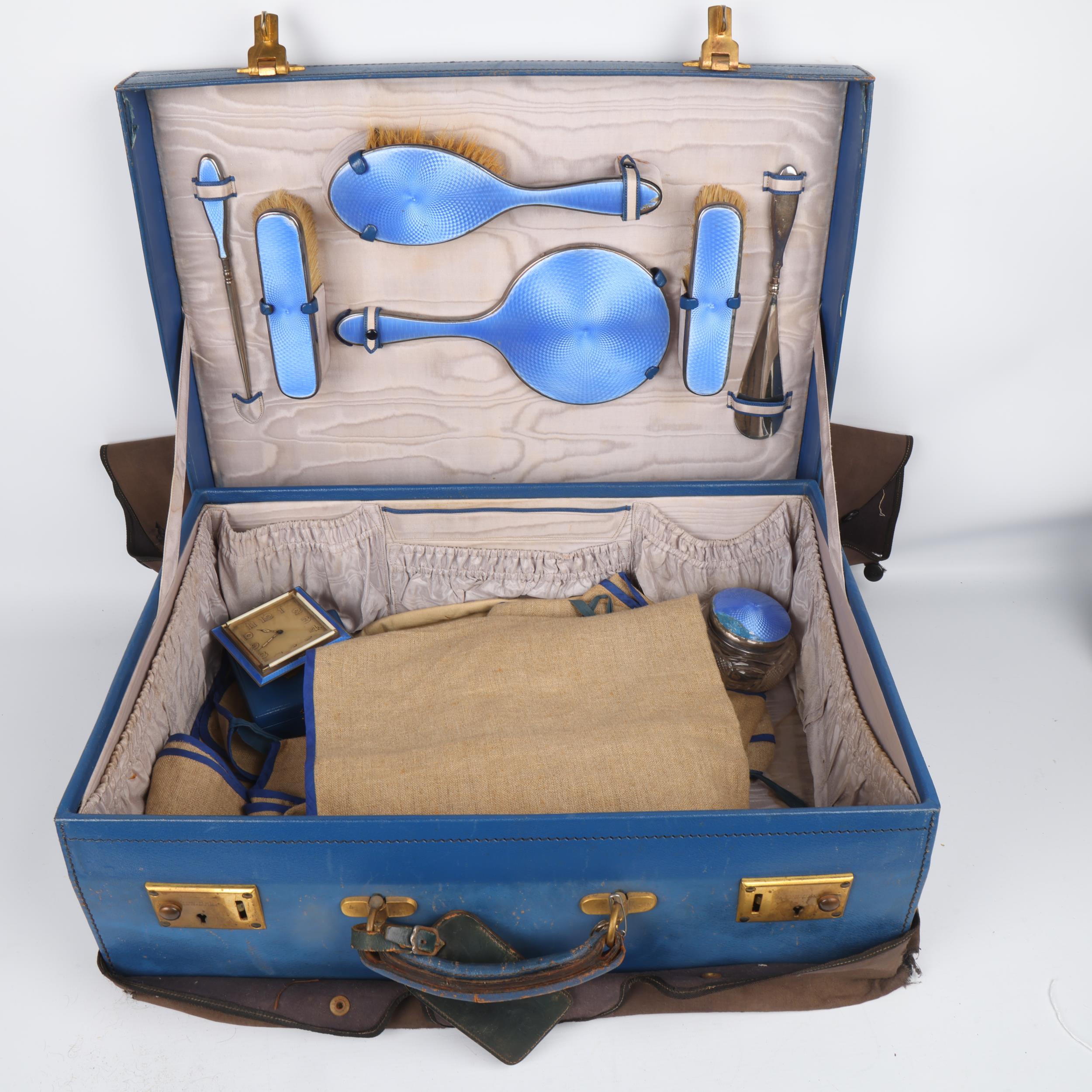 An Art Deco George V blue leather travelling vanity case, containing the original silver and blue - Image 3 of 3