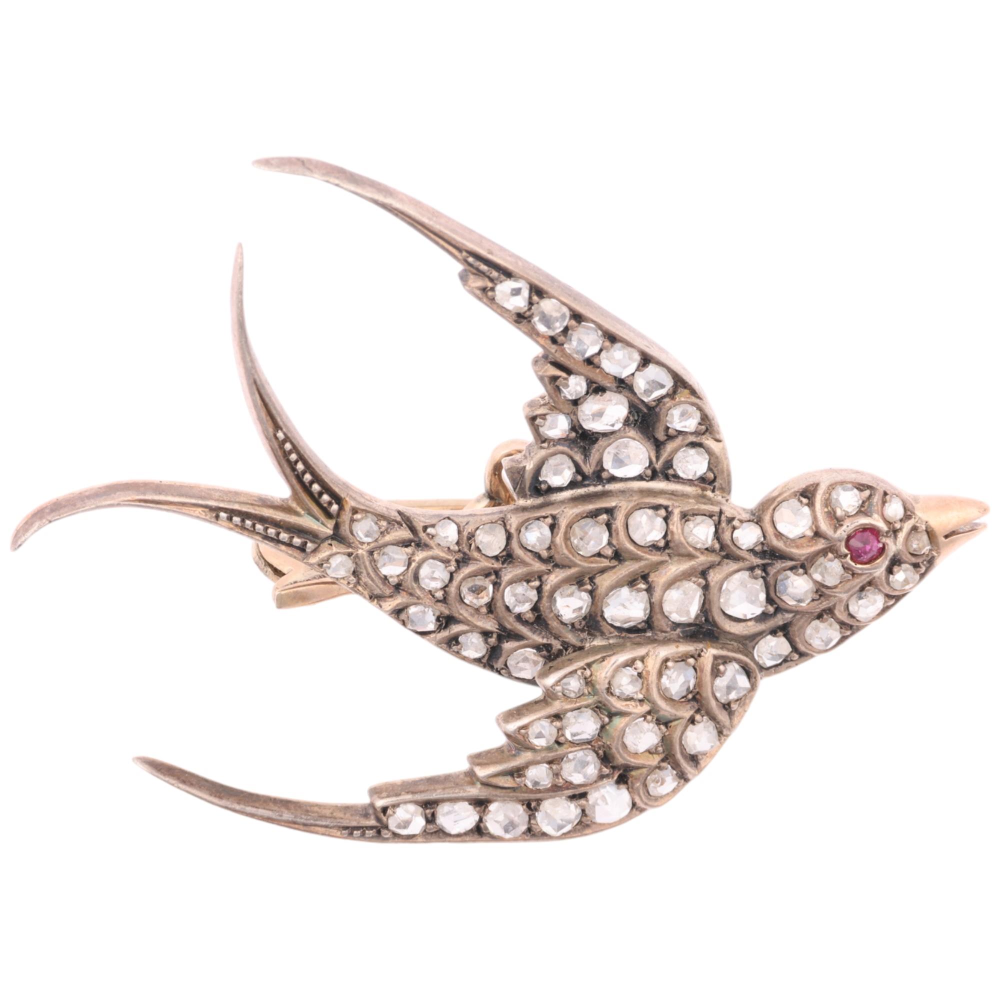 A 19th century ruby and diamond figural swallow bird brooch, circa 1890, set with rose-cut diamonds,