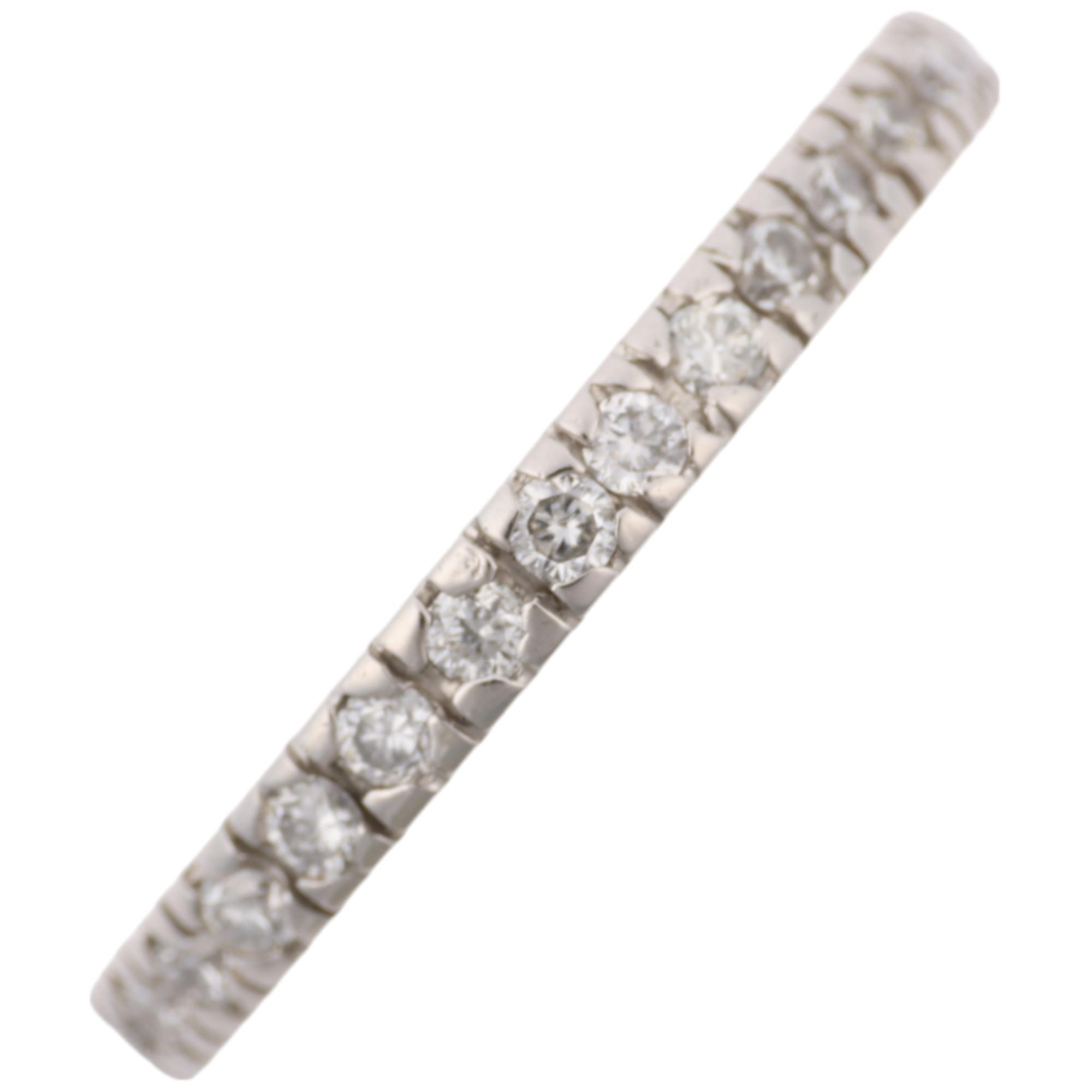 A modern platinum diamond full eternity ring, set with modern round brilliant-cut diamonds, total