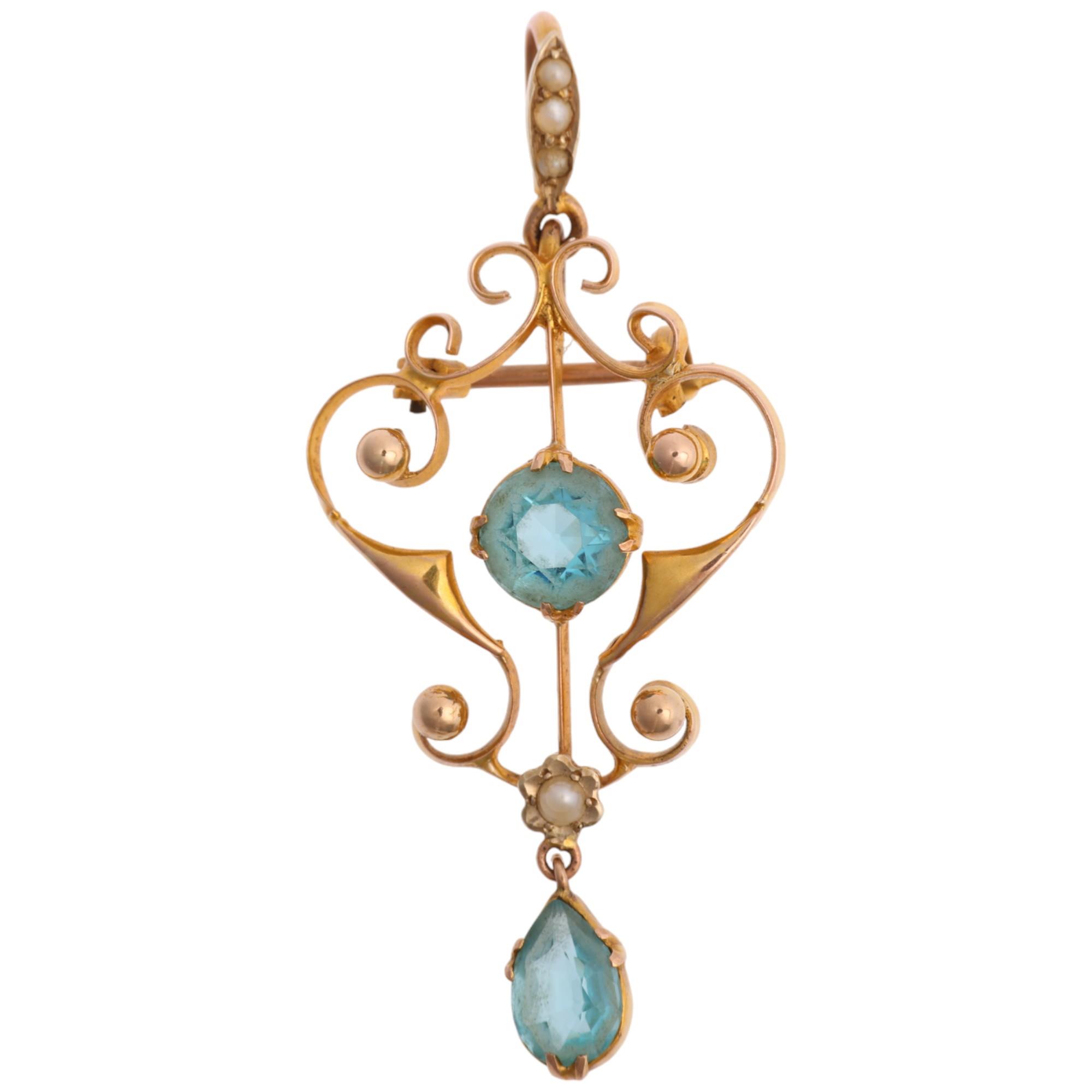 An Edwardian 9ct gold blue paste and pearl openwork pendant/brooch, 48.9mm, 3g Condition Report: