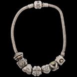 PANDORA - a sterling silver snake link charm bracelet, with 7 silver charms, 21cm, 37.5g Condition