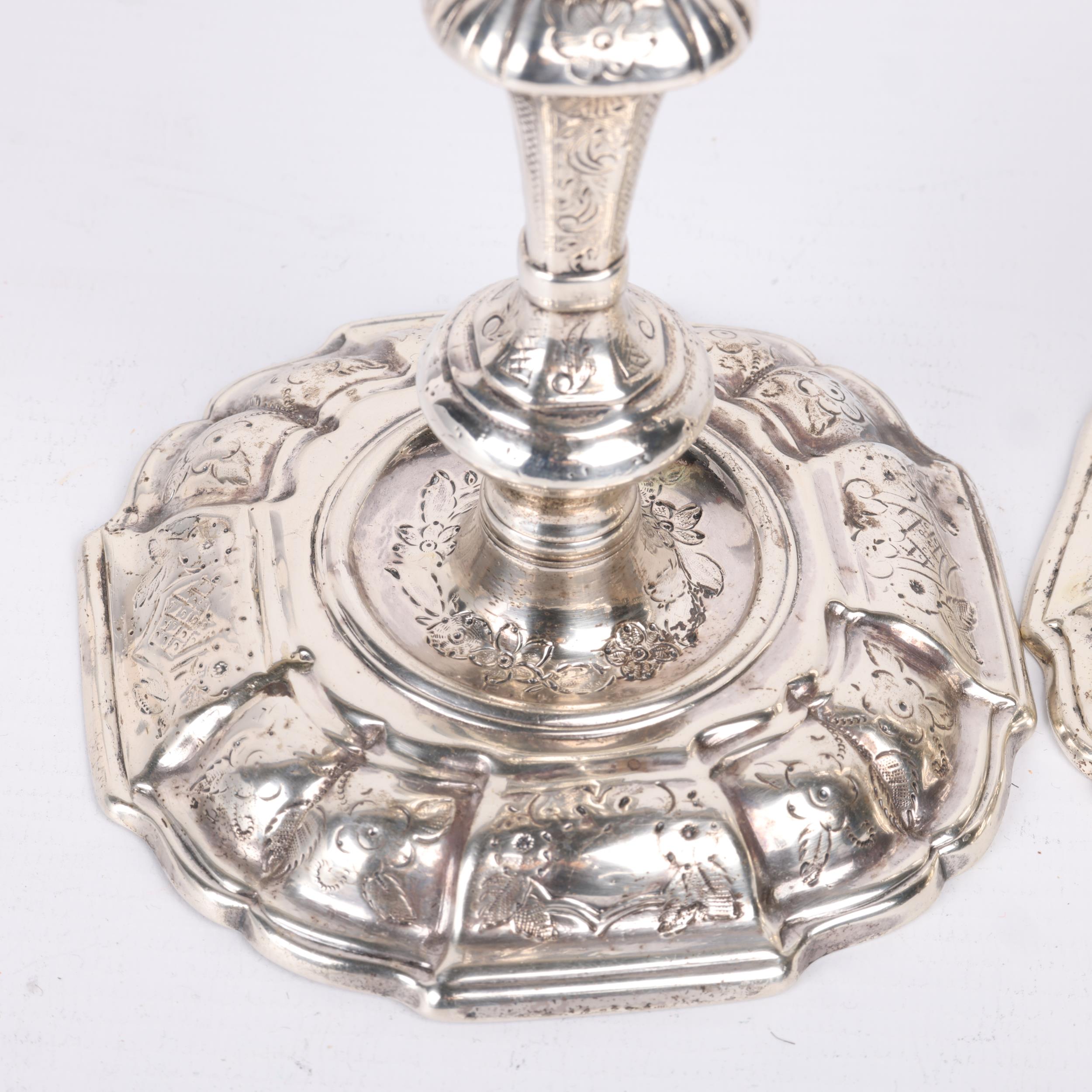 A pair of George II silver table candlesticks, Joseph Bird, London 1732, bright-cut engraved - Image 3 of 3