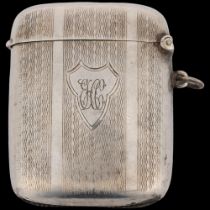 A George V curved silver Vesta case, Joseph Gloster Ltd, Birmingham 1925, rectangular form with