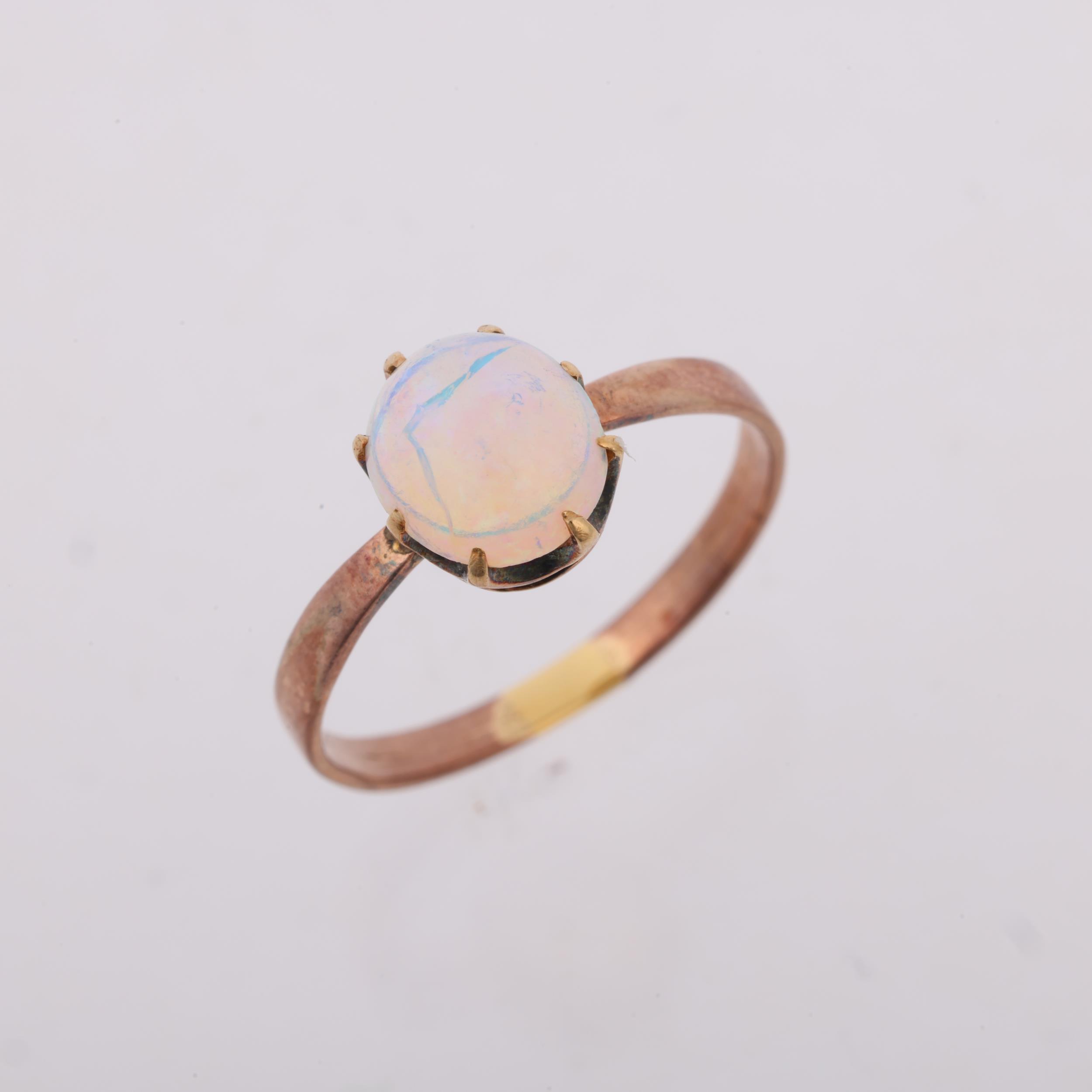 An early 20th century solitaire opal ring, claw set with 1ct oval cabochon opal, opal measures - Image 2 of 4