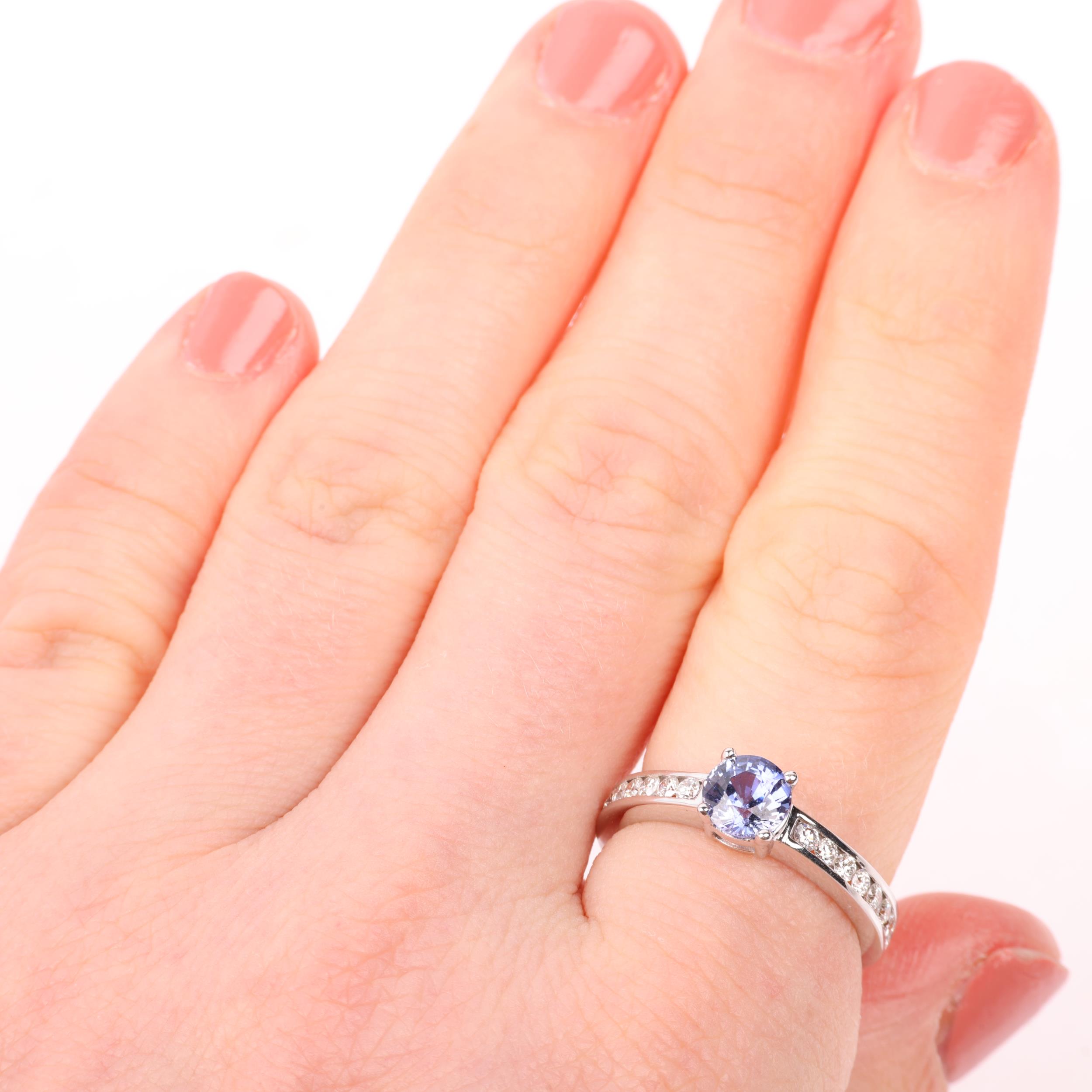 A modern 18ct white gold tanzanite and diamond ring, set with round-cut tanzanite and modern round - Image 4 of 4