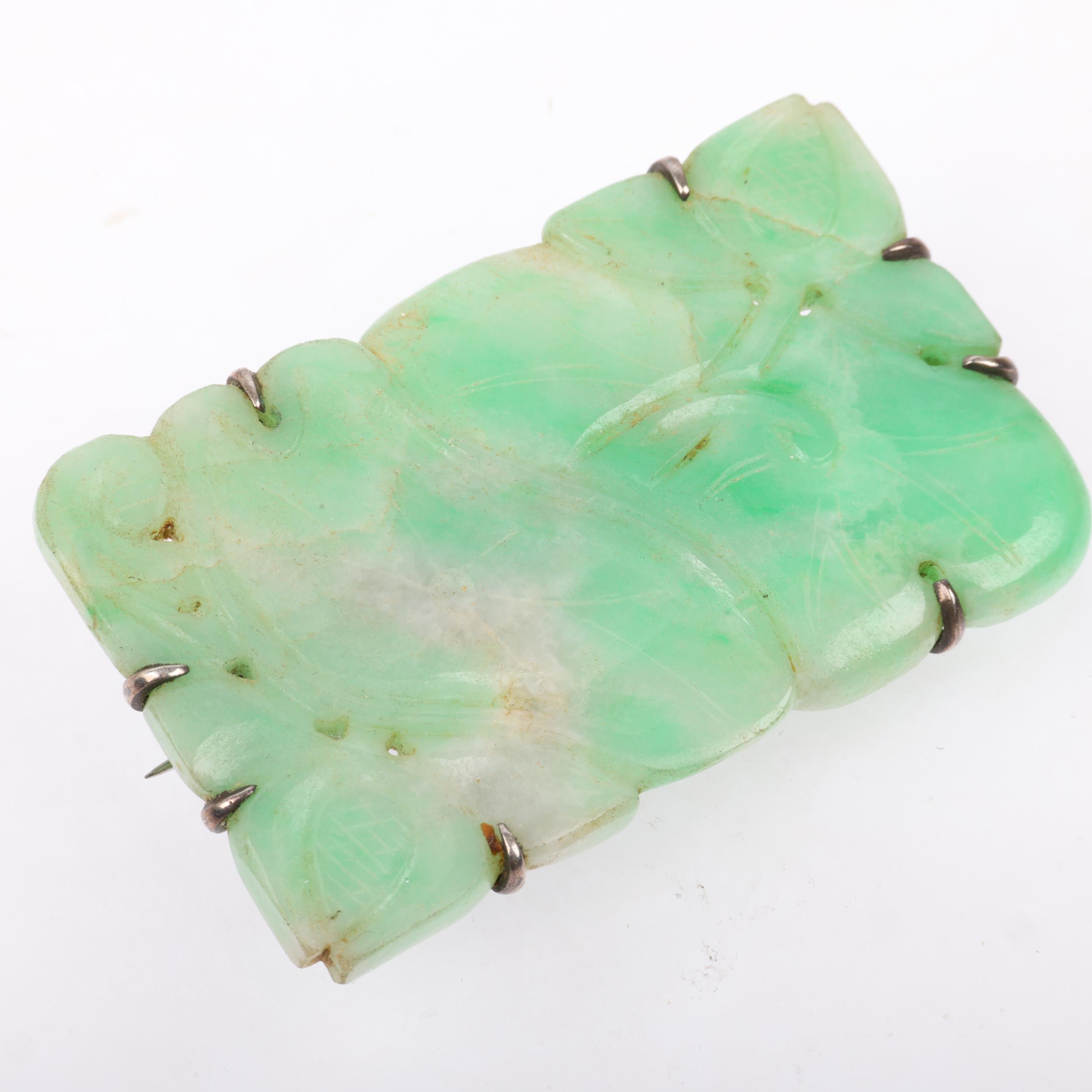 An early 20th century carved and polished jade floral panel brooch, apparently unmarked, 60.1mm, - Image 2 of 3