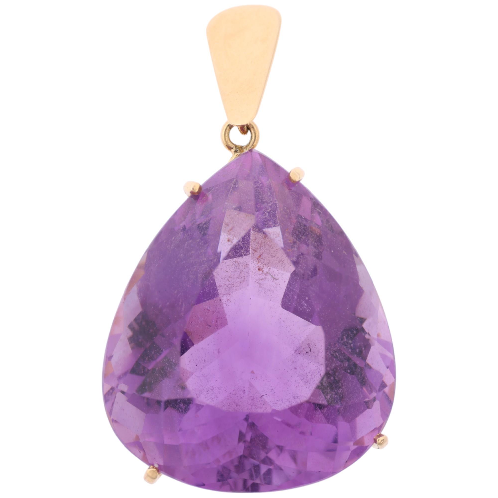 A 14ct gold amethyst drop pendant, set with 28ct pear-cut amethyst, 33.4mm, 6.8g Condition Report: