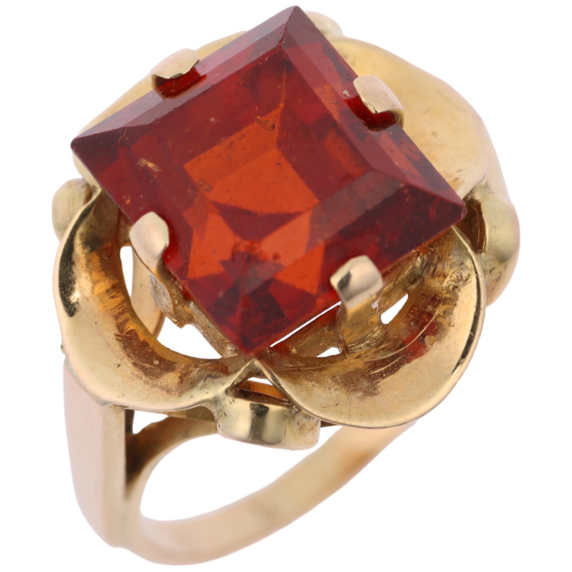 A late 20th century hessonite garnet dress ring, claw set with 9ct rectangular step-cut garnet, - Image 2 of 4