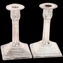 A pair of late Victorian silver Grecian Revival table candlesticks, James Deakin & Son, Sheffield