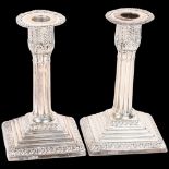 A pair of late Victorian silver Grecian Revival table candlesticks, James Deakin & Son, Sheffield