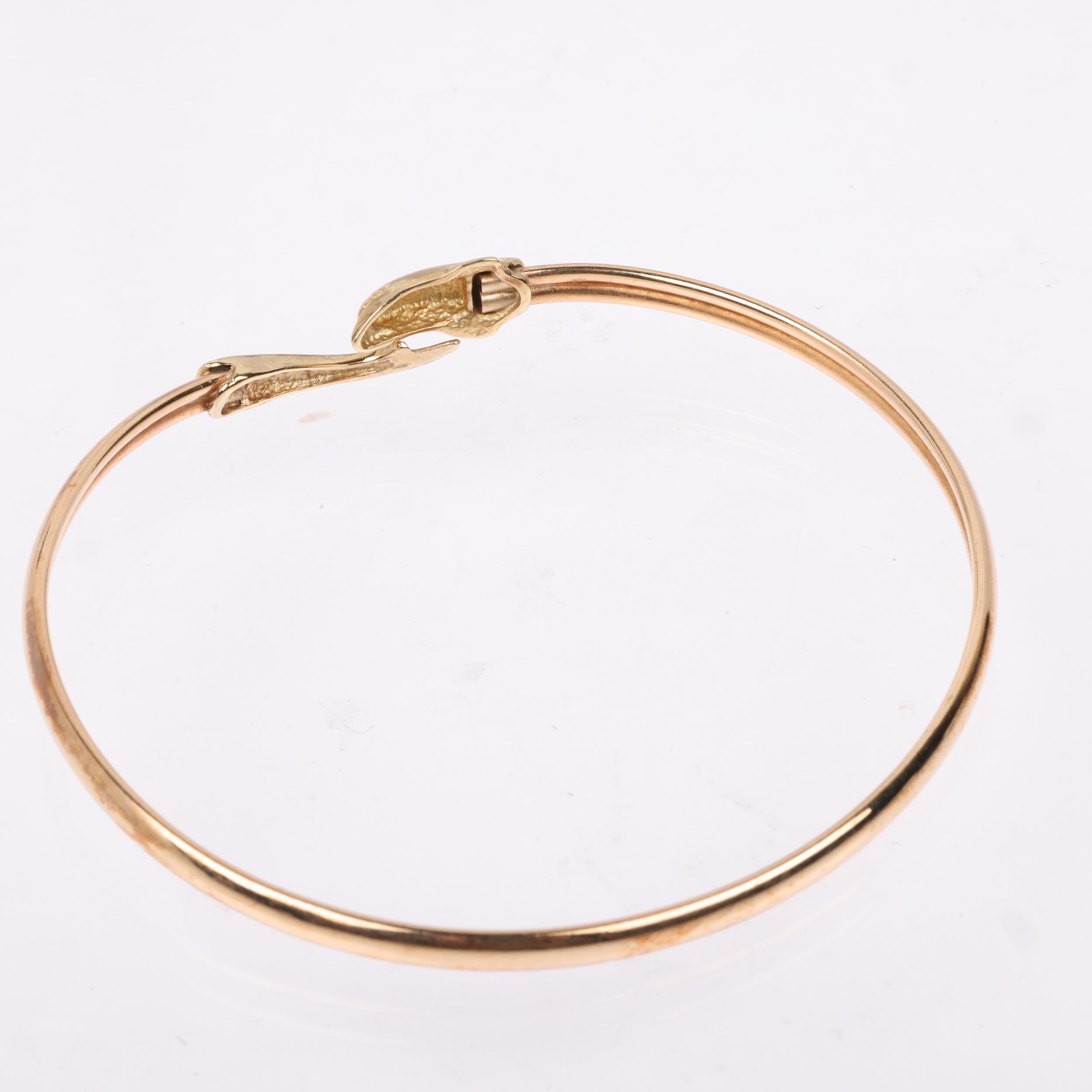 A late 20th century 9ct gold dolphin torque bangle, maker CJ Ltd, Birmingham 1993, band width 3.6mm, - Image 3 of 4