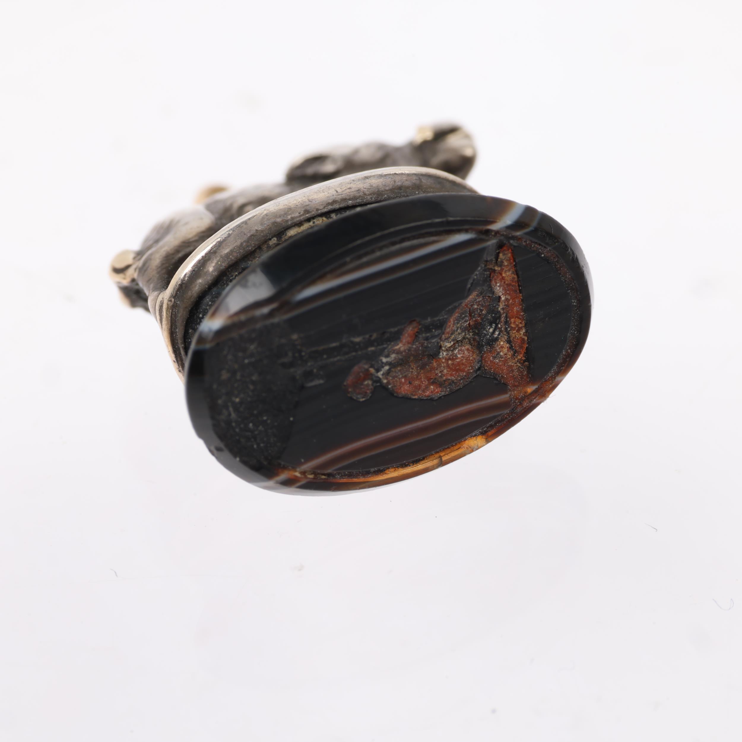 A 19th century silver and gold wild boar banded agate 'Crucifixion' seal fob, apparently unmarked, - Image 3 of 3