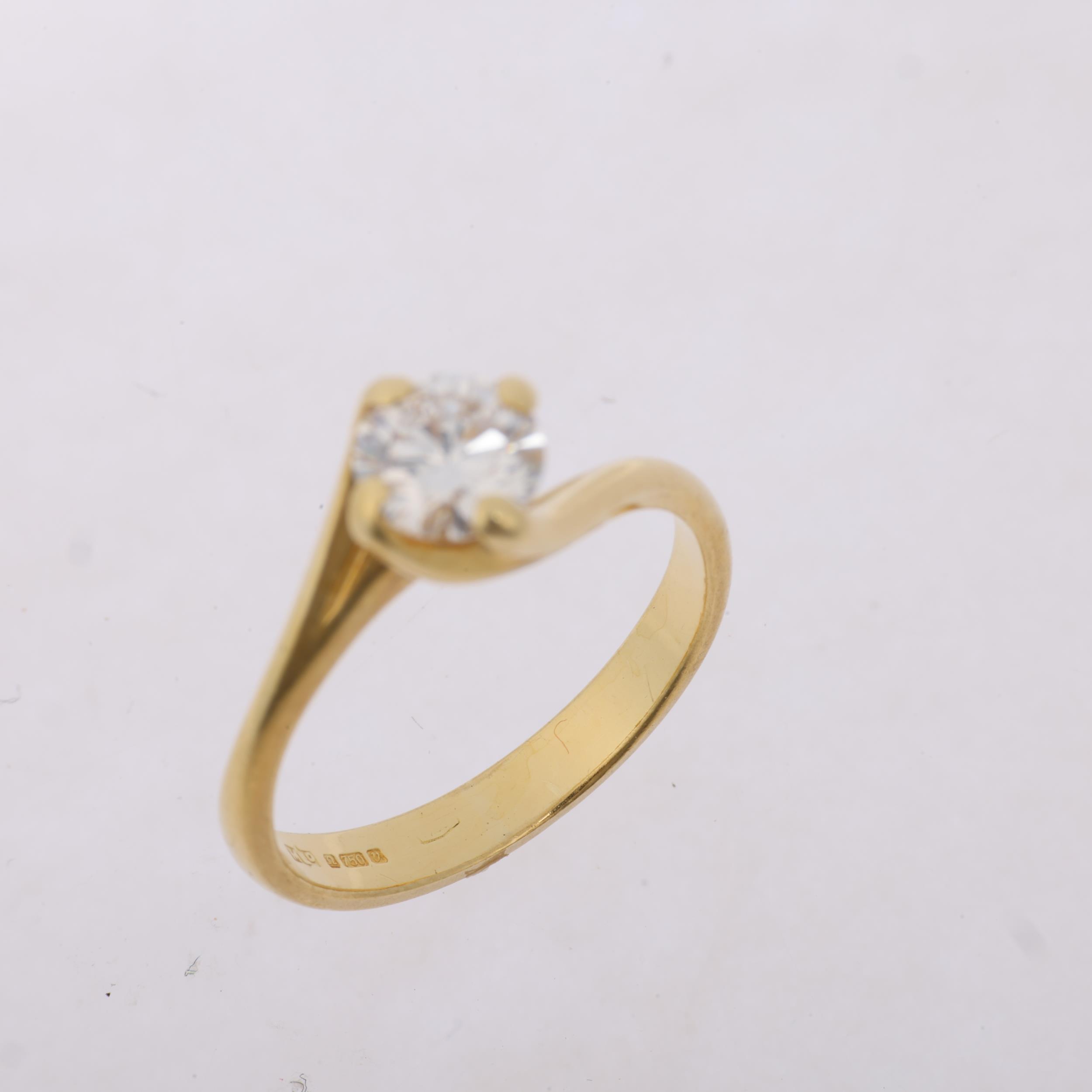 An 18ct gold 0.6ct solitaire diamond ring, crossover claw set with modern round brilliant-cut - Image 3 of 4