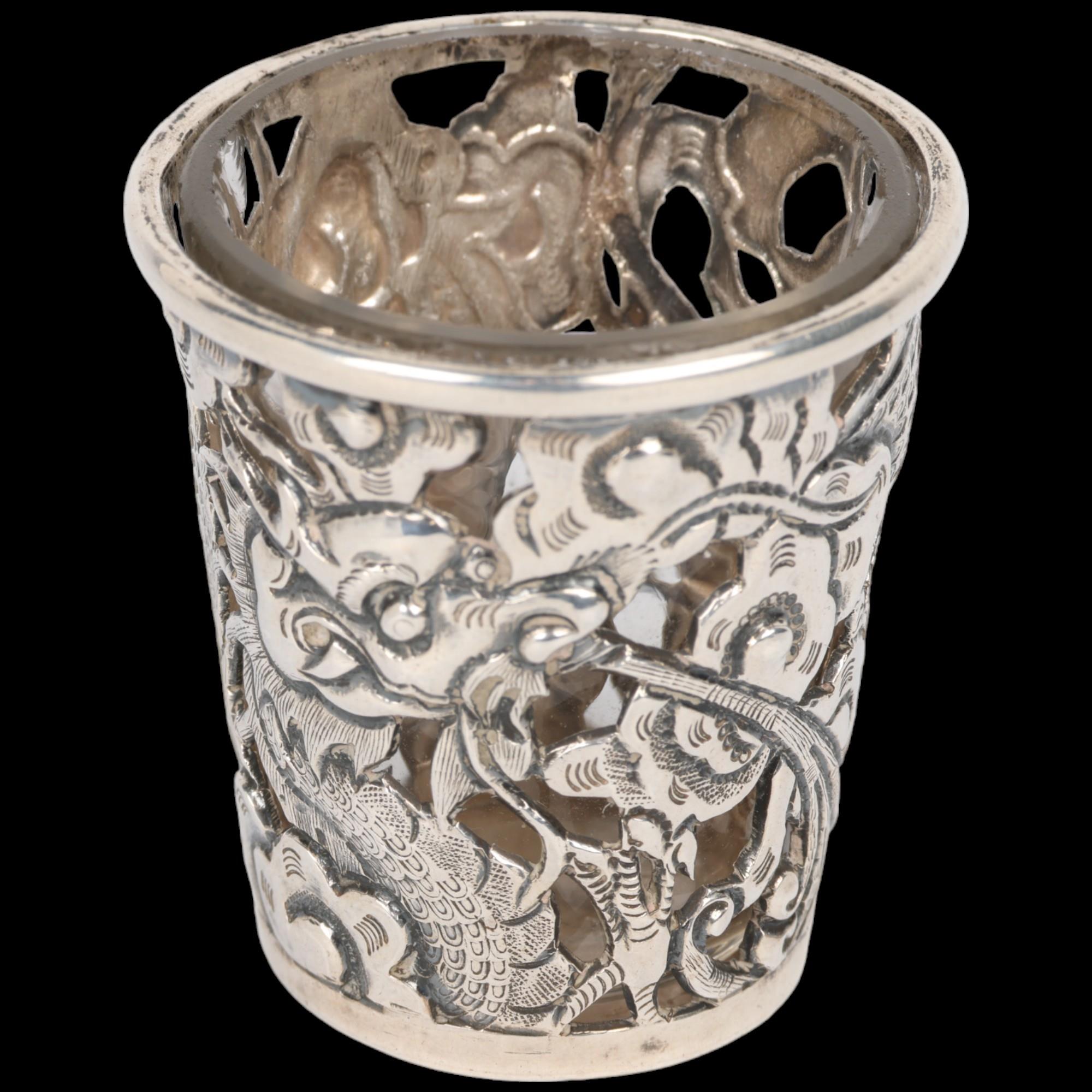 A Chinese export silver 'Dragon' drinking tot, circa 1900, signed with Artisan mark, retailed by