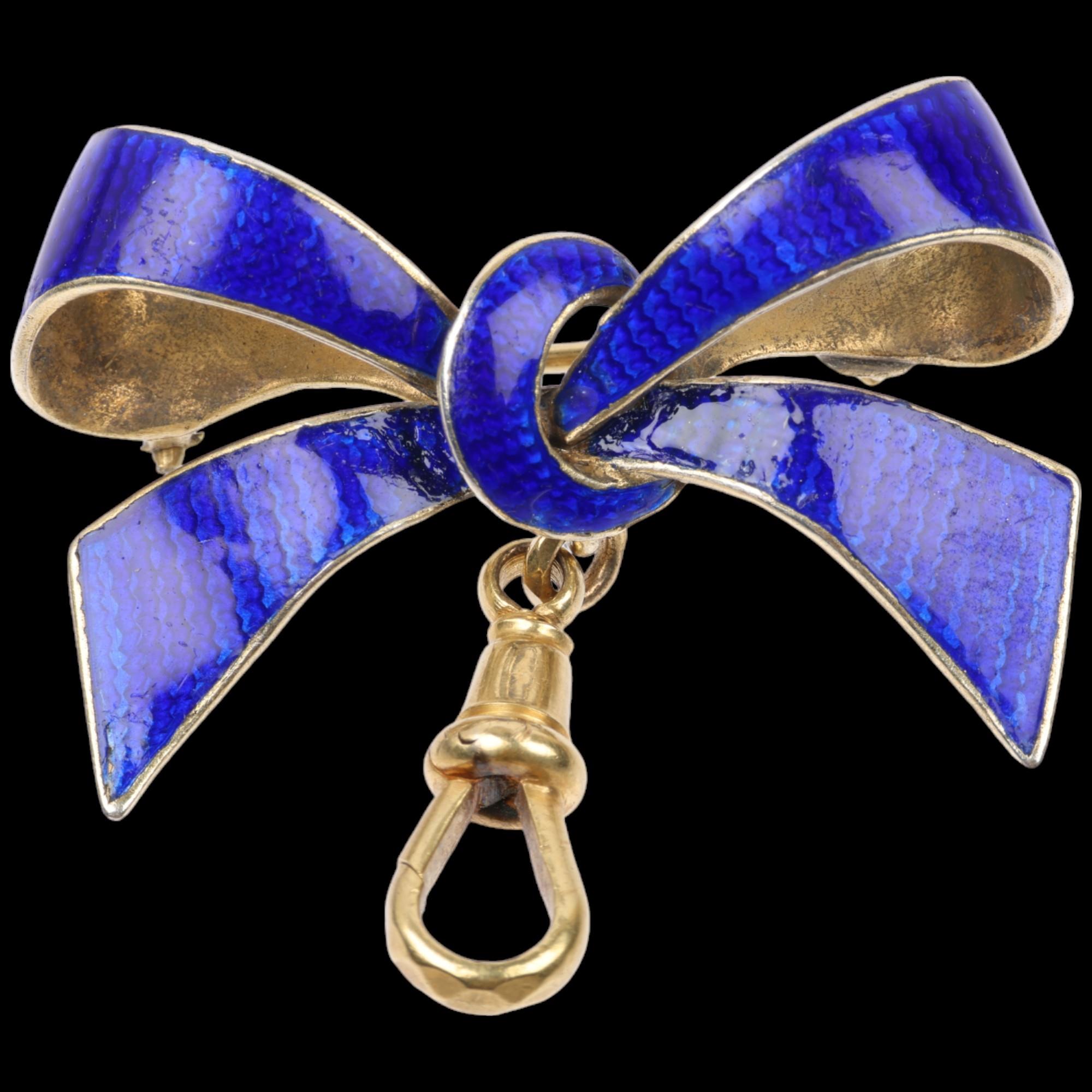 A Continental silver-gilt blue enamel ribbon bow brooch, with 9ct gold dog-clip, 34.6mm, 6.6g