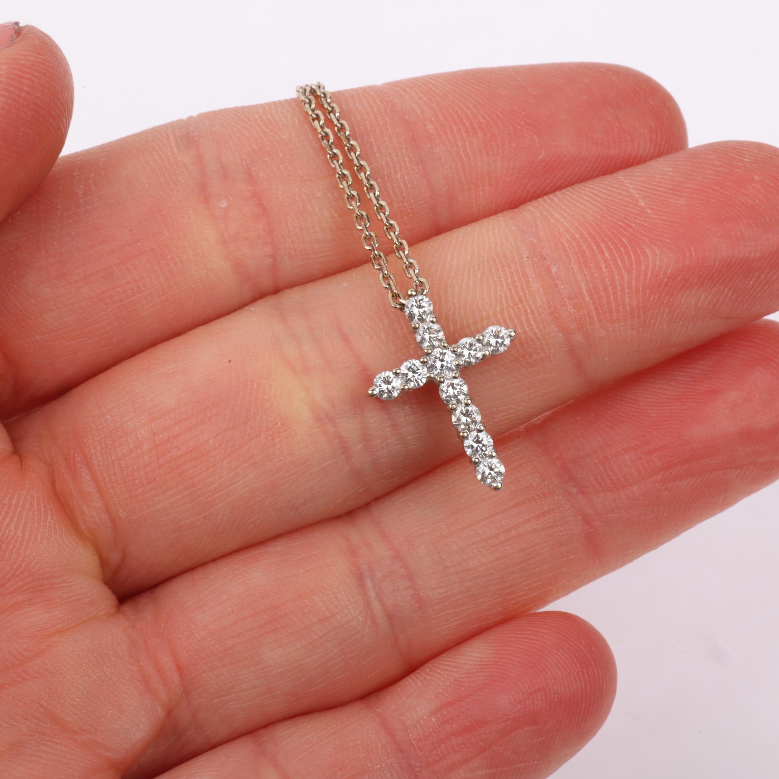 An 18ct white gold diamond cross pendant necklace, claw set with modern round brilliant-cut - Image 4 of 4