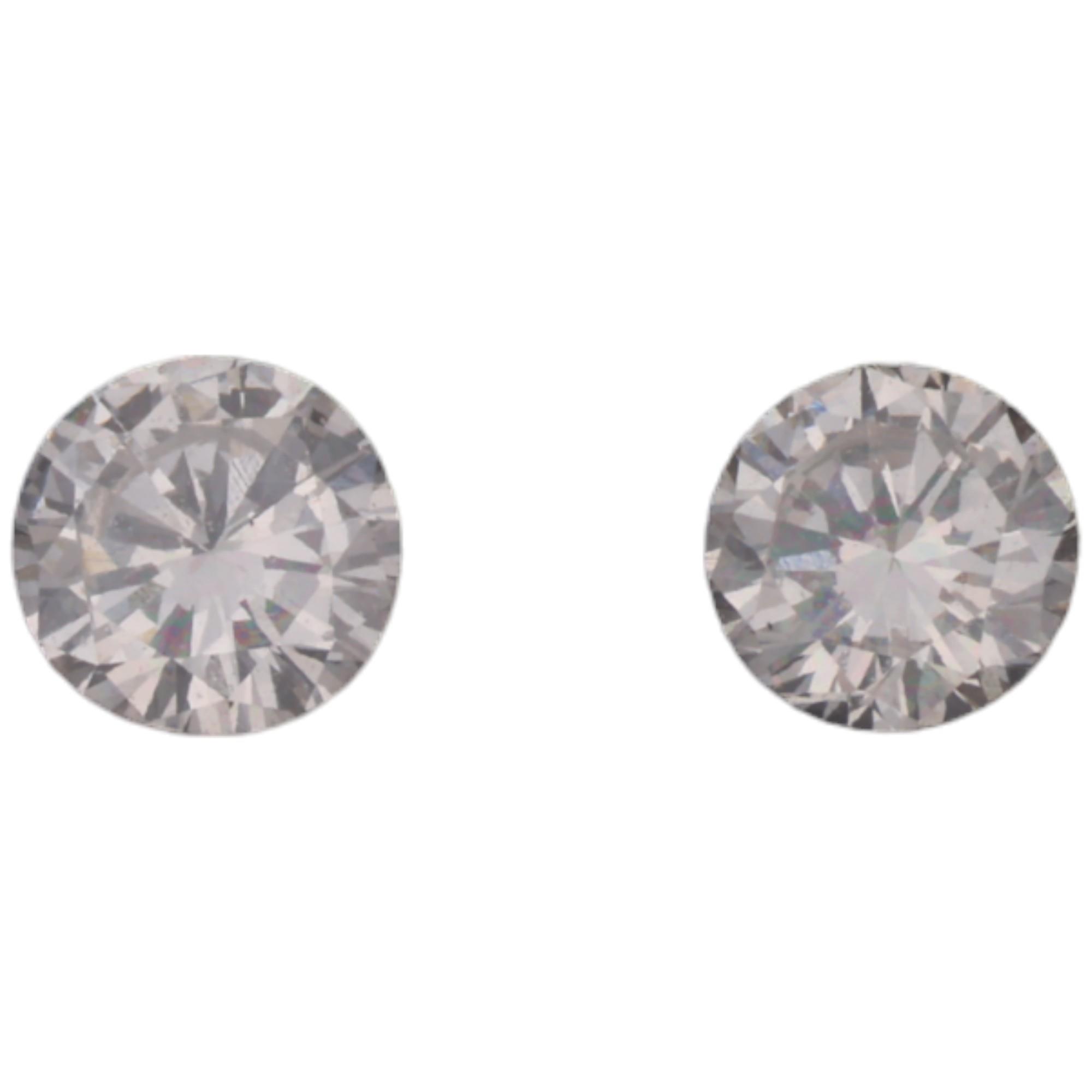 2 unmounted 0.11ct modern round brilliant-cut diamonds, colour approx H-I, clarity approx VS, from