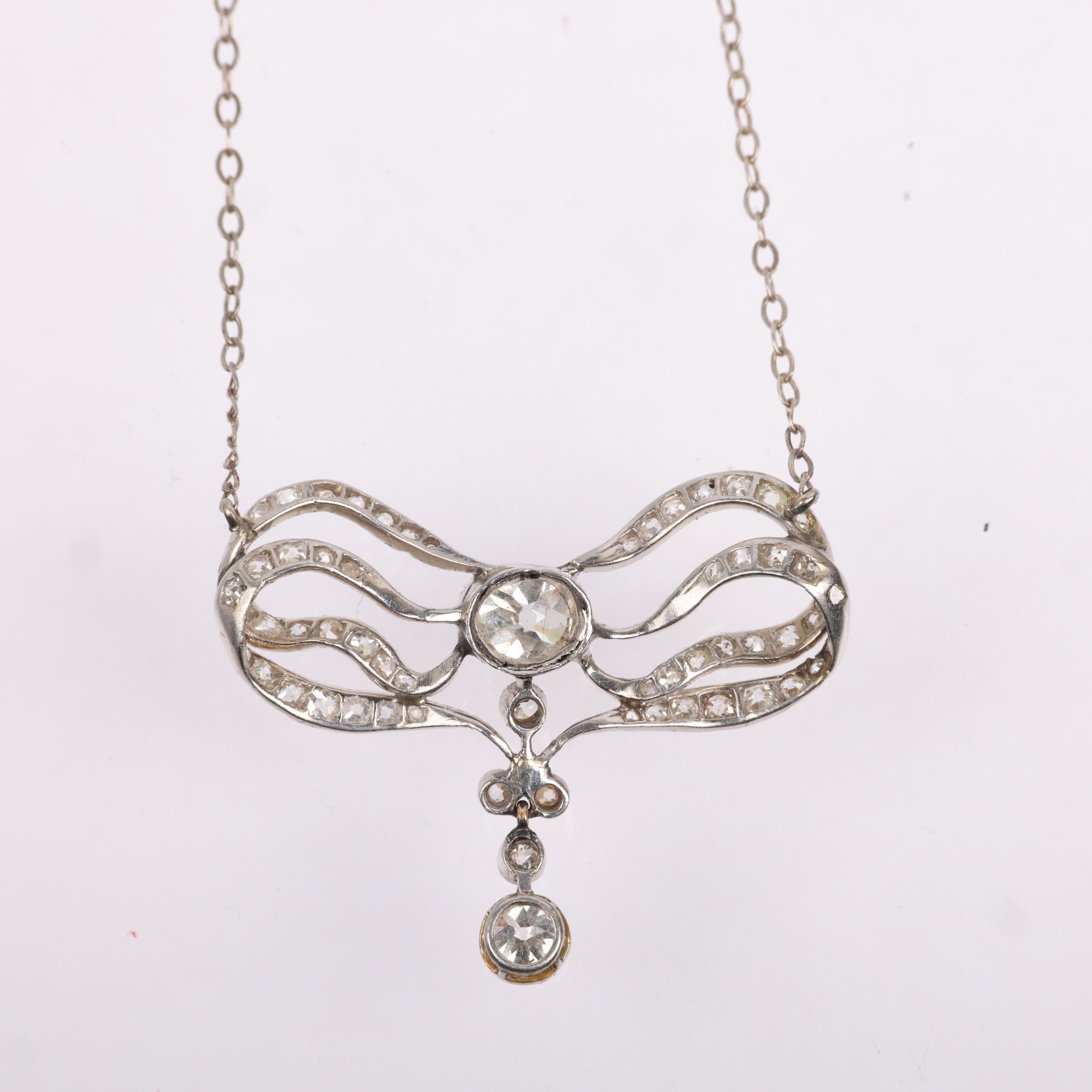 An Art Nouveau French diamond ribbon bow pendant necklace, circa 1910, set with old and eight-cut - Image 3 of 4