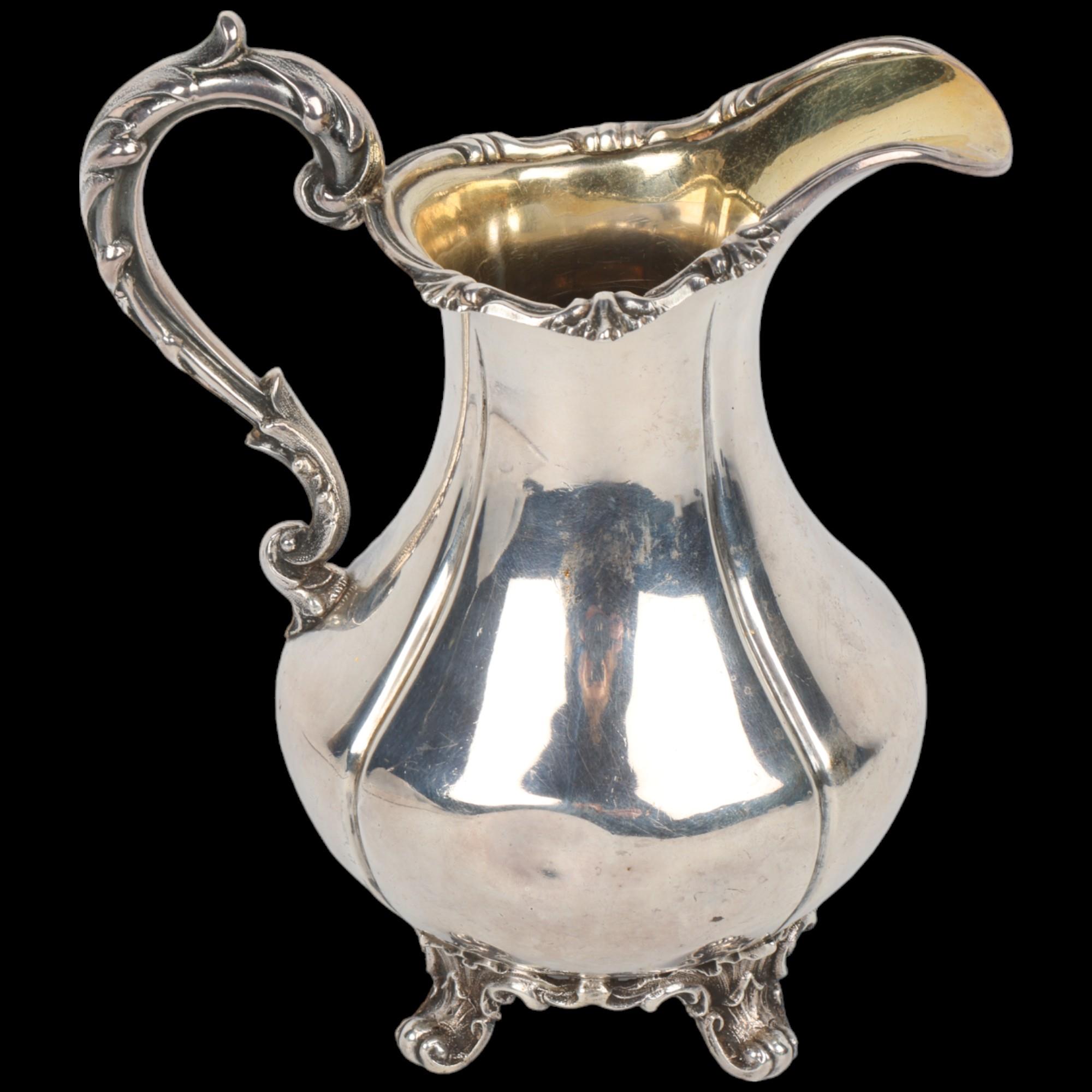 An early Victorian silver pumpkin cream jug, Richard Devonshire, London 1848, baluster form with