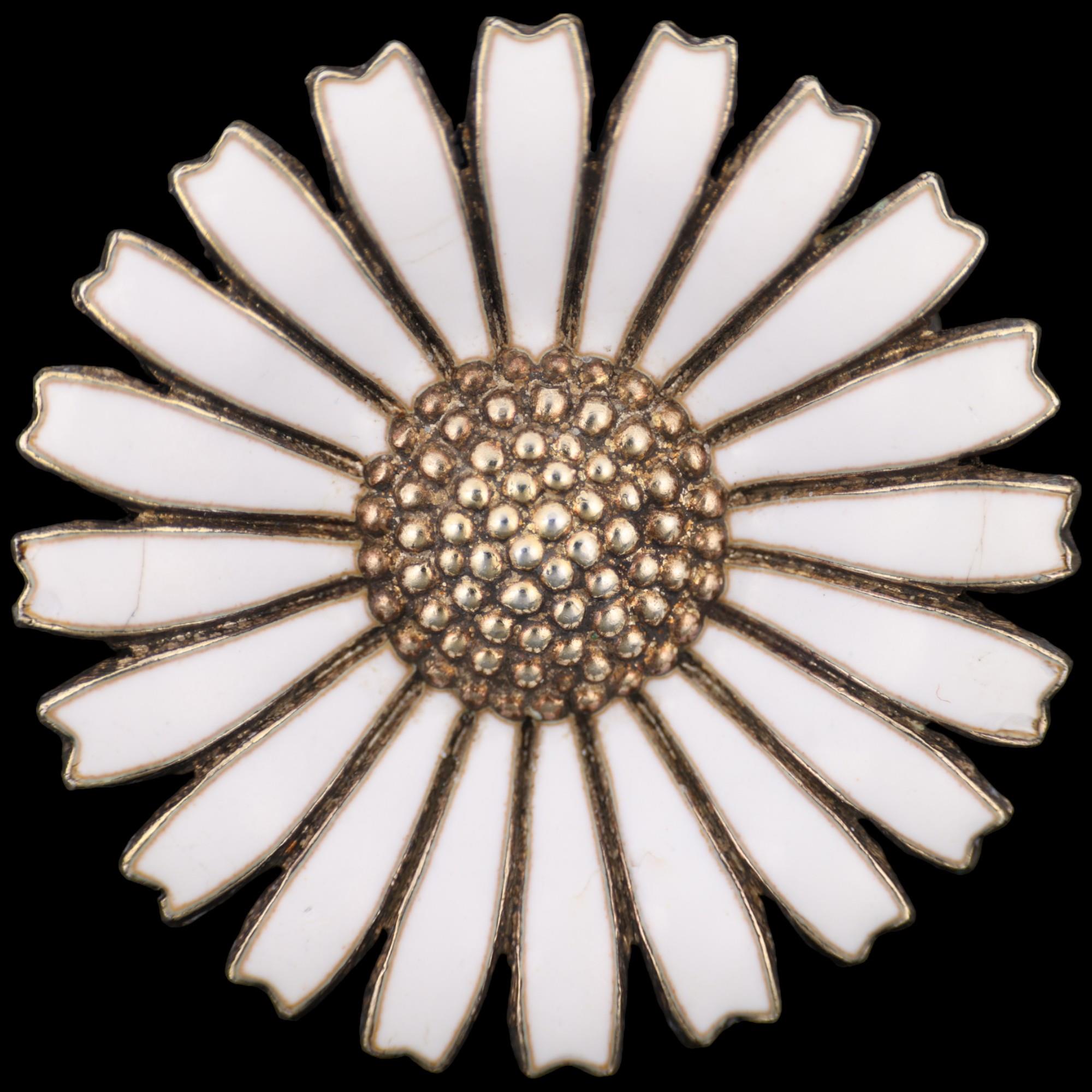 ANTON MICHELSEN - a Danish vermeil sterling silver and white enamel daisy pattern brooch, 32.5mm,