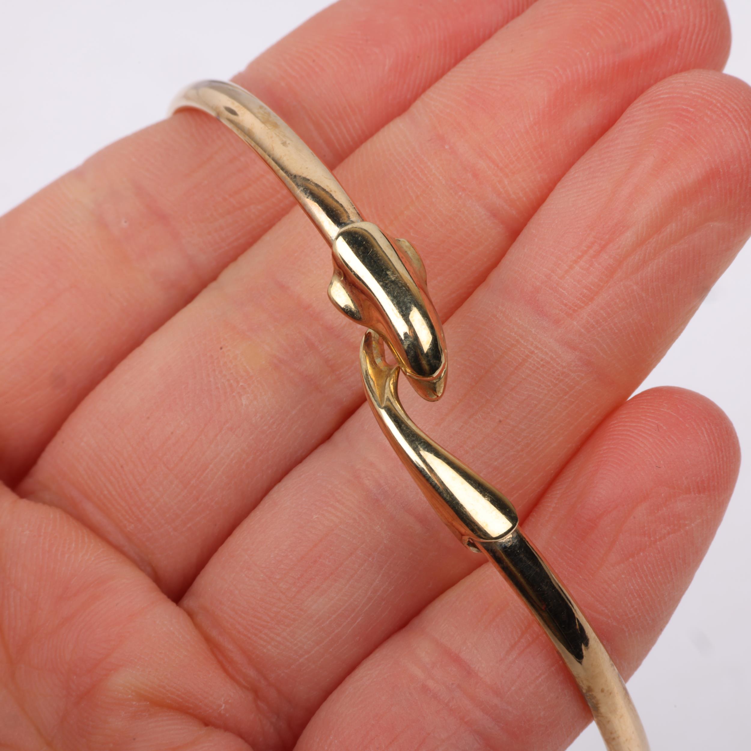 A late 20th century 9ct gold dolphin torque bangle, maker CJ Ltd, Birmingham 1993, band width 3.6mm, - Image 4 of 4