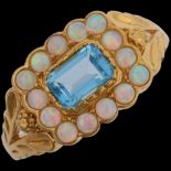 A modern silver-gilt blue topaz and synthetic opal cluster ring, in the Georgian style, setting