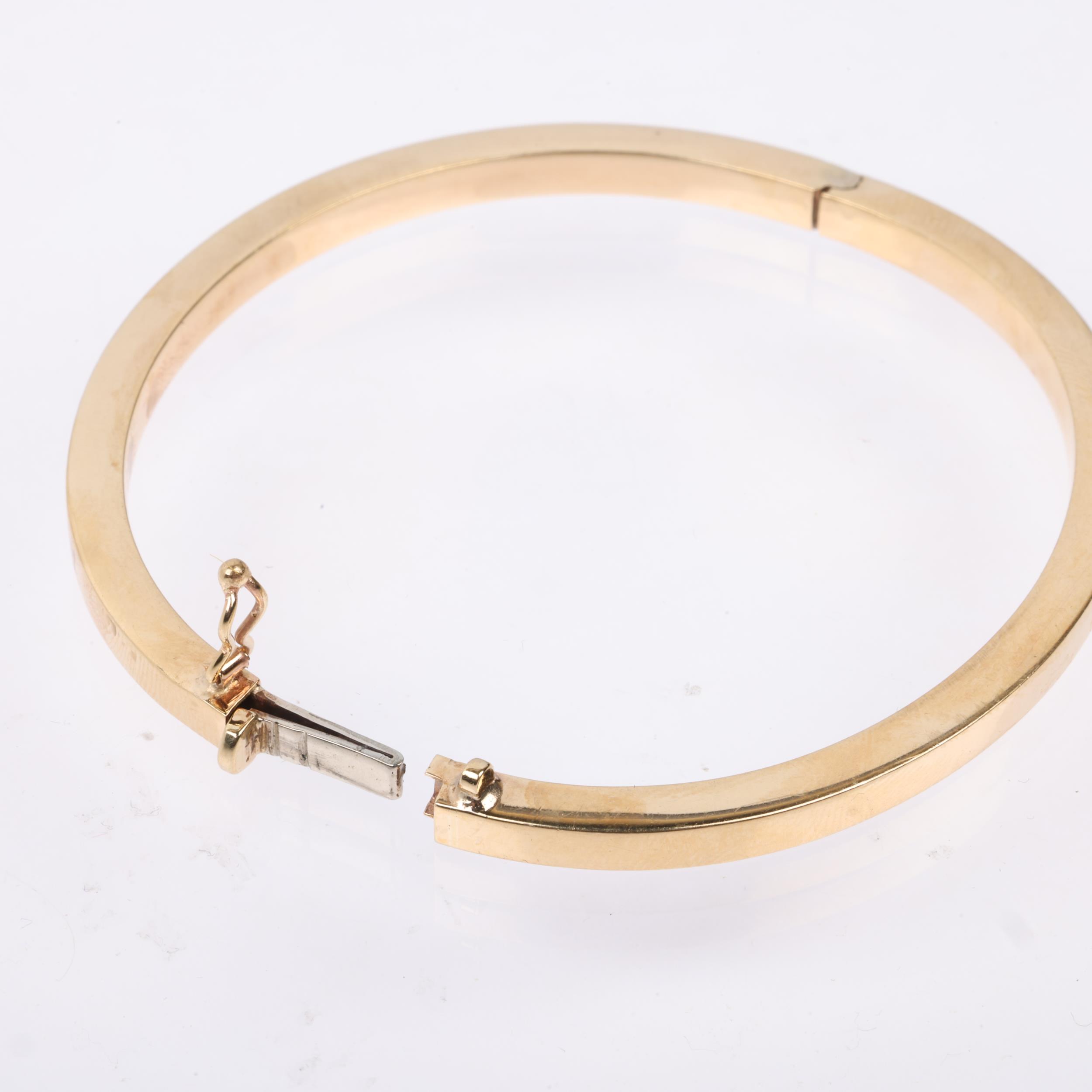 A 9ct gold plain hinged bangle, band width 4.1mm, internal circumference 18cm, 10.7g Condition - Image 3 of 4