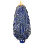 A large Ethnic carved lapis lazuli idol head teardrop pendant, with unmarked yellow metal mount,