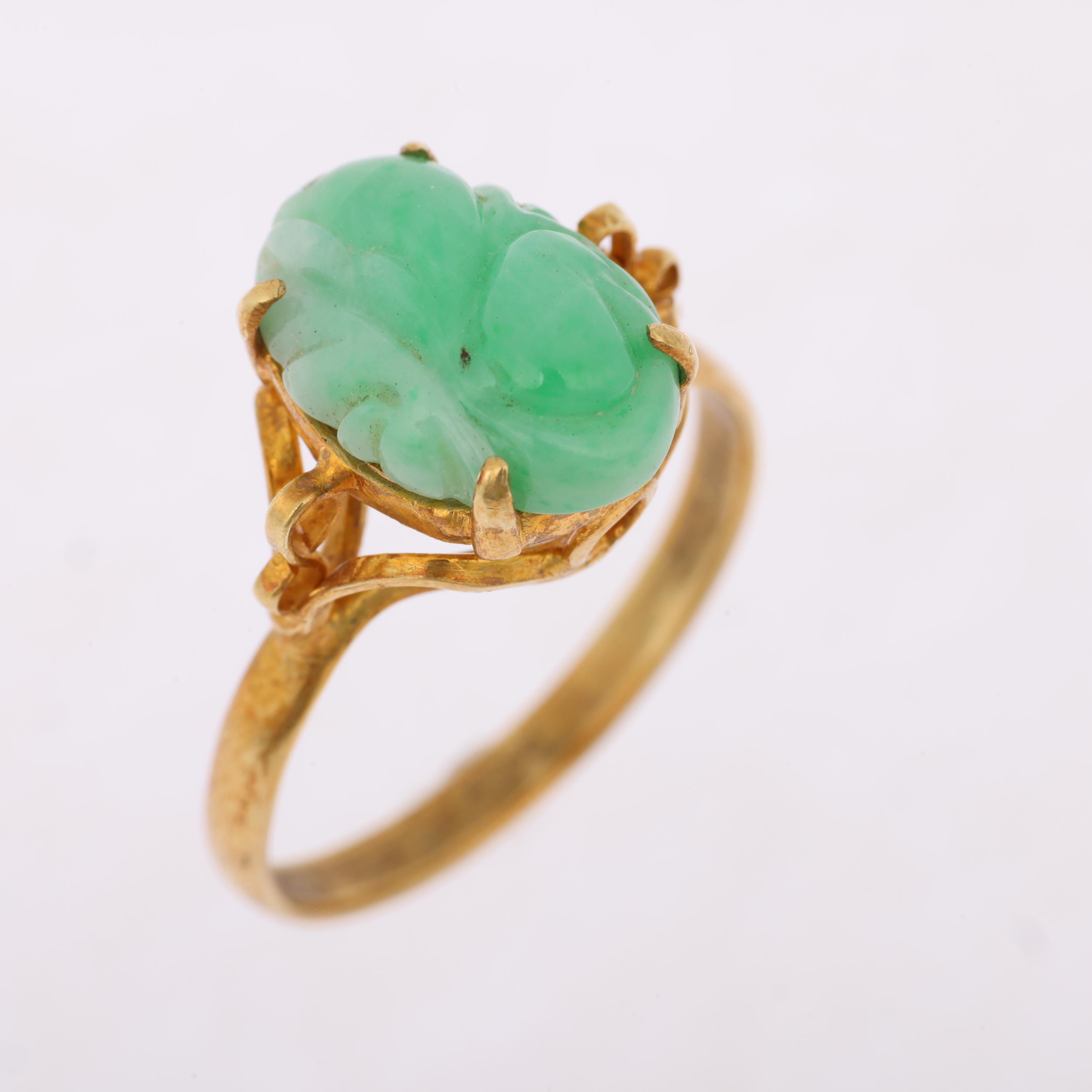 A Chinese 14ct gold carved jade panel ring, setting height 13.7mm, size T, 4.2g Condition Report: No - Image 2 of 4