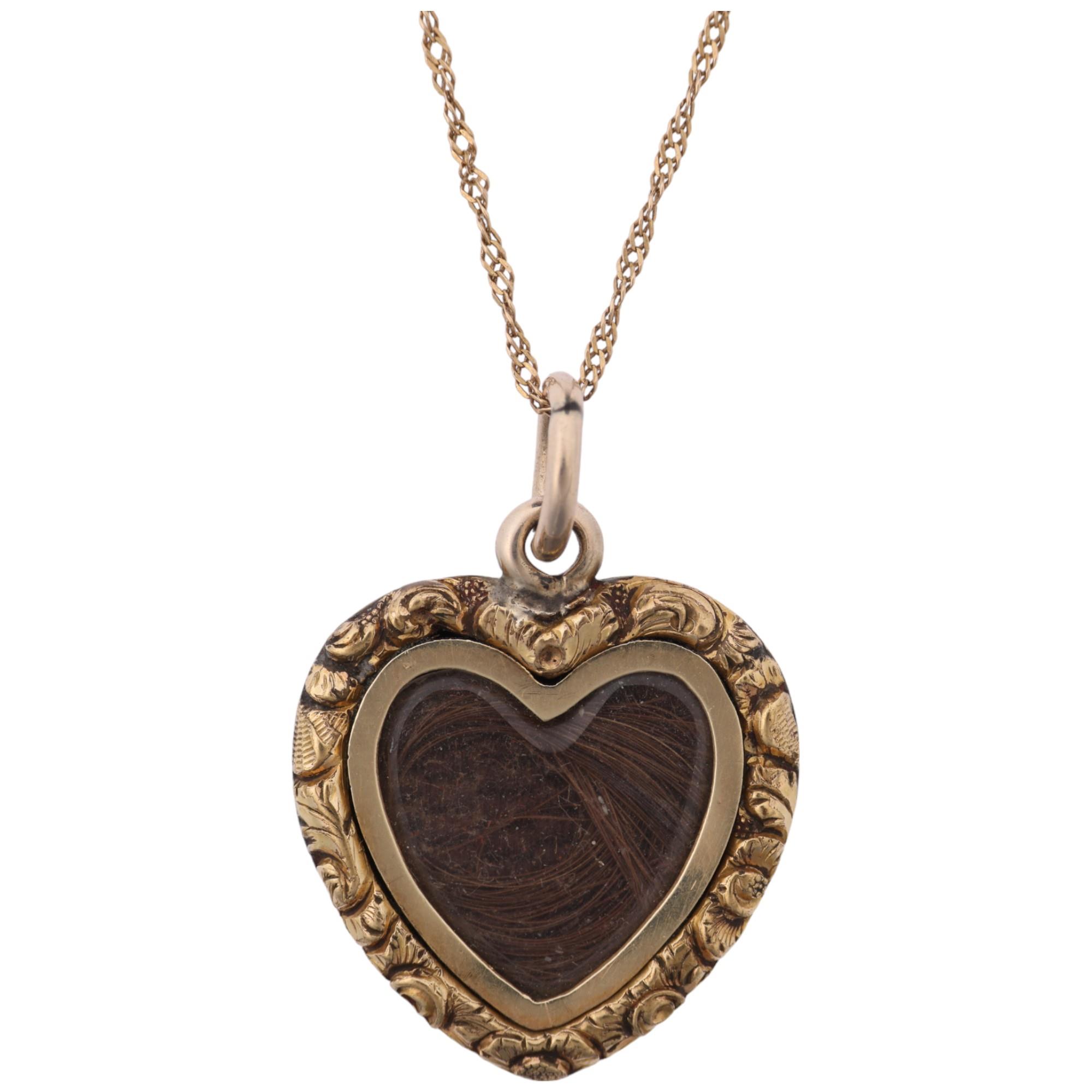 A Victorian hairwork heart mourning sweetheart pendant necklace, circa 1850, the central hairwork