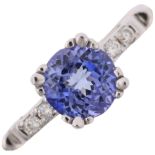 A modern tanzanite and diamond dress ring, set with round-cut tanzanite and modern round brilliant-