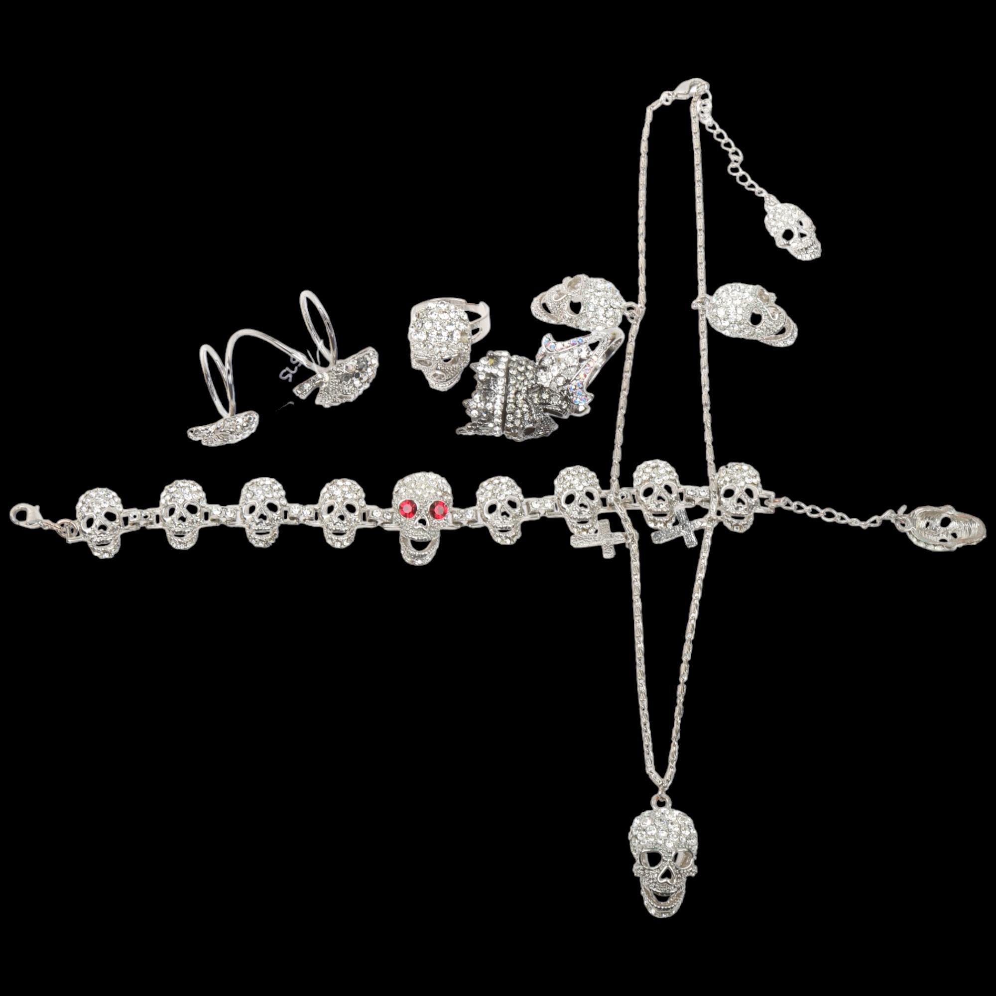 BUTLER & WILSON - a Vintage rhinestone skull jewellery set, comprising necklace, bracelet and 3