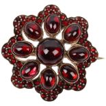 A Victorian Bohemian garnet flowerhead cluster brooch, set with round and oval cabochon garnet