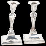 A pair of late Victorian silver table candlesticks, Richard Hodd & Son, London 1896, in the Sheritan