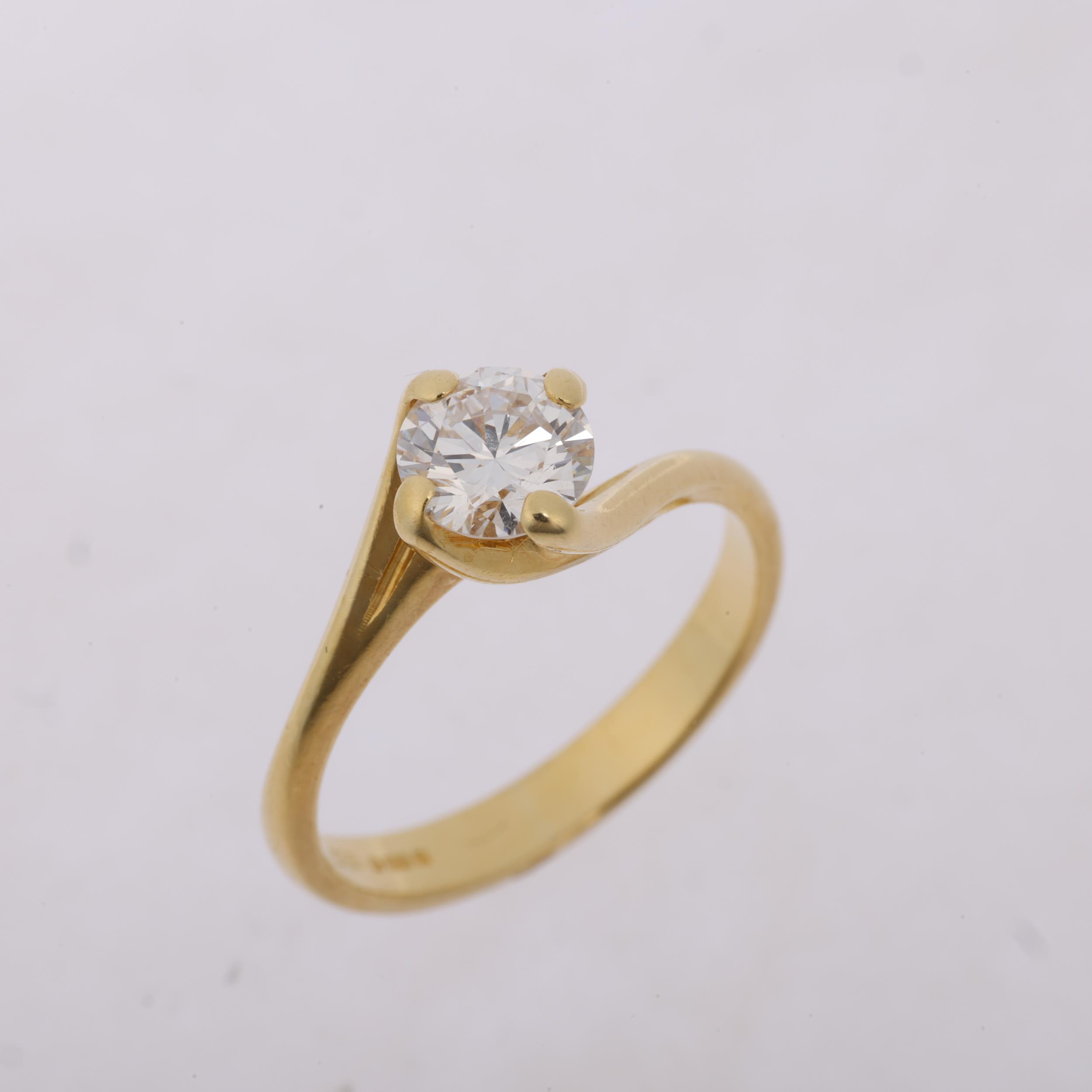 An 18ct gold 0.6ct solitaire diamond ring, crossover claw set with modern round brilliant-cut - Image 2 of 4