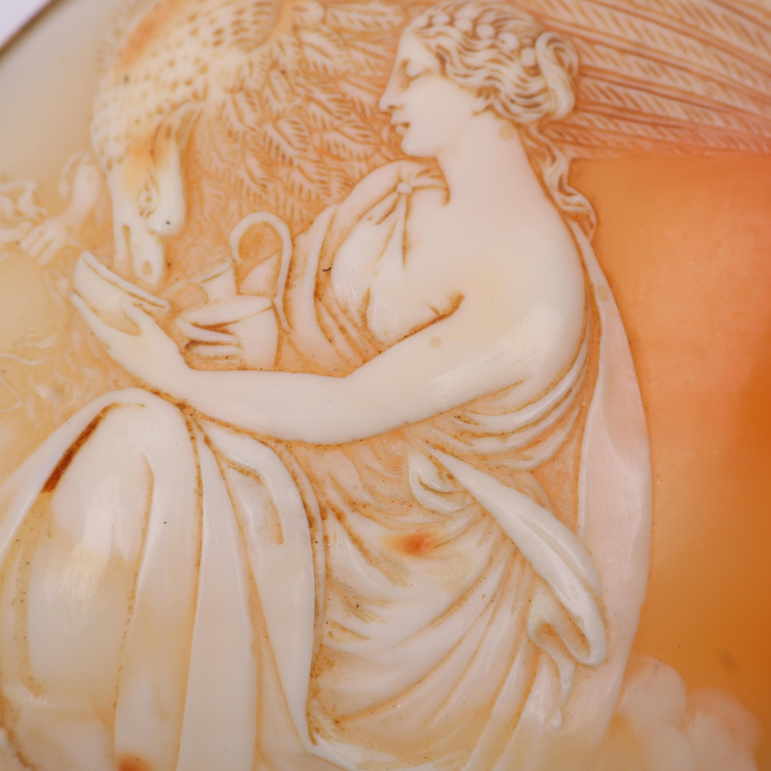 A large Victorian shell cameo brooch, relief carved depicting Hebe feeding eagle Zeus, in unmarked - Image 2 of 4