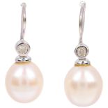 A pair of 18ct white gold whole pearl and diamond earrings, with shepherd hook fittings, 24mm, 3.