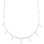 A modern 18ct white gold diamond fringe necklace, each graduated drop set with modern round