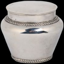 An Edwardian silver baluster tea caddy, Sibray, Hall & Co Ltd, London 1908, oval form with gadrooned