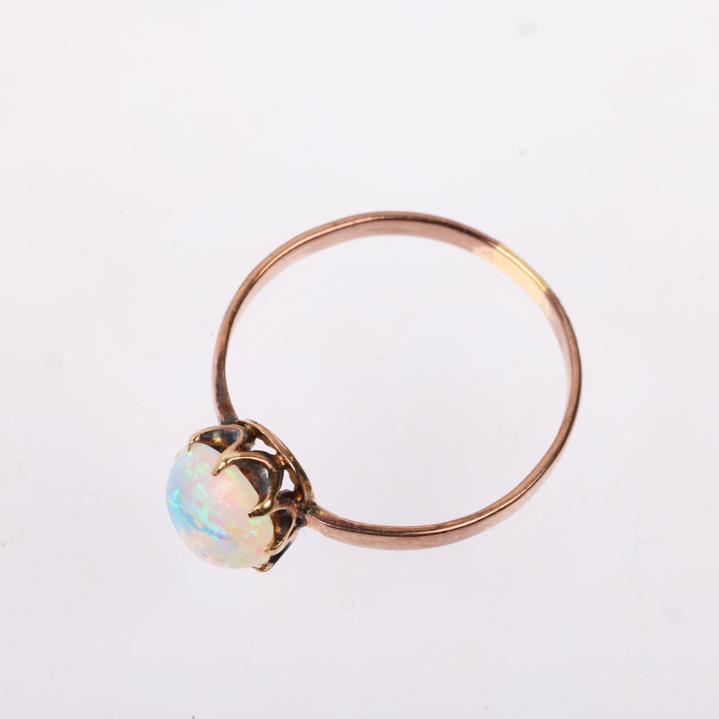 An early 20th century solitaire opal ring, claw set with 1ct oval cabochon opal, opal measures - Image 3 of 4
