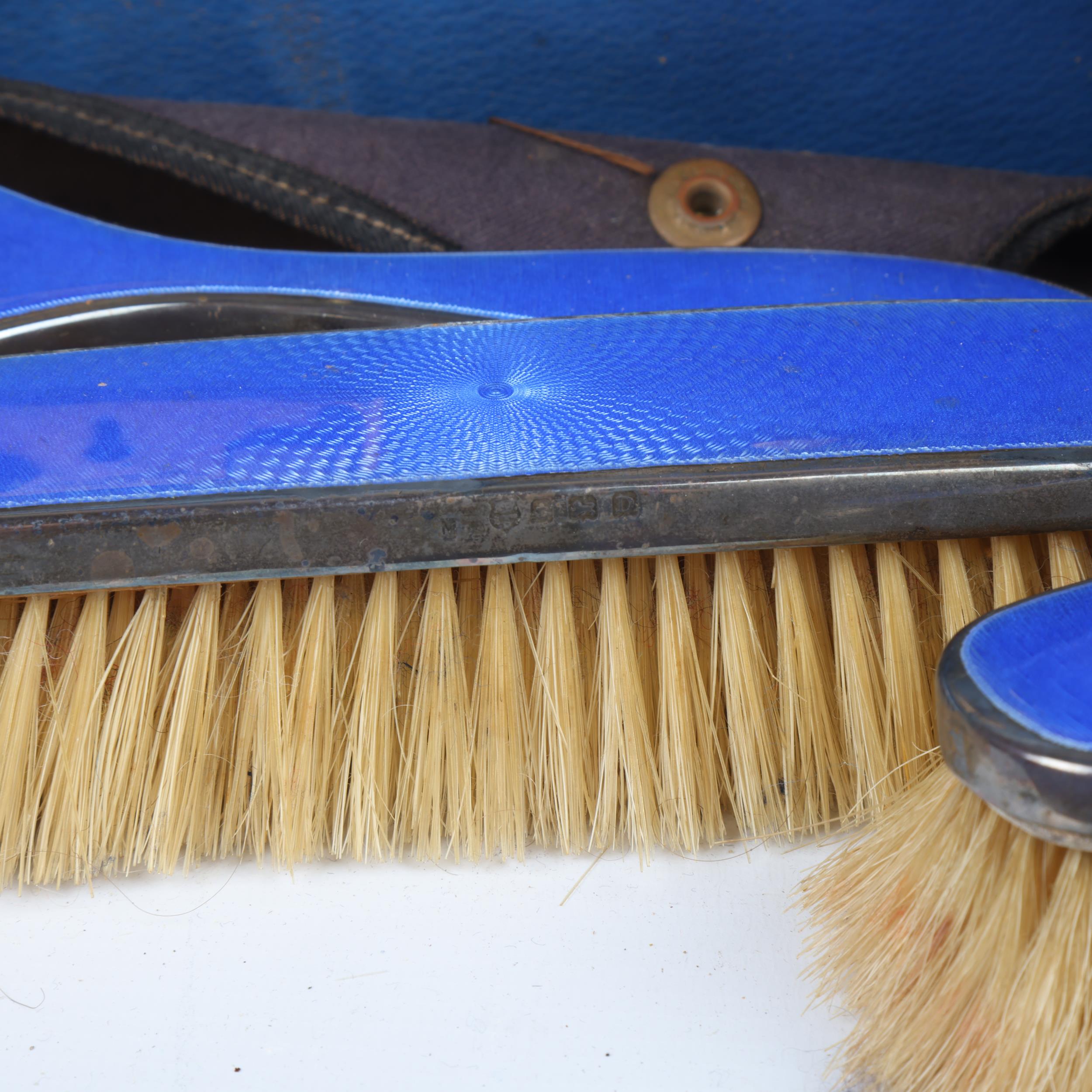 An Art Deco George V blue leather travelling vanity case, containing the original silver and blue - Image 2 of 3